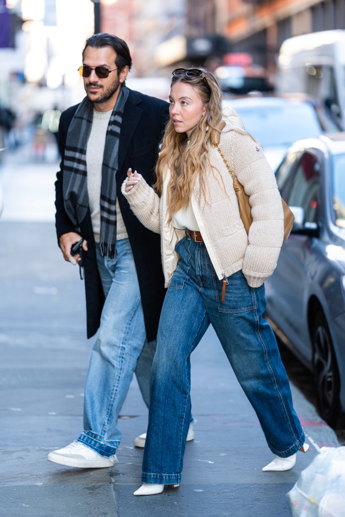 NEW YORK, NEW YORK - DECEMBER 14: Jonathan Davino (L) and Sydney Sweeney are seen in SoHo on December 14, 2024 in New York City. (Photo by TheStewartofNY/GC Images)