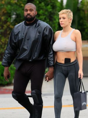 Kanye West and Bianca Censori holding hands and walking
