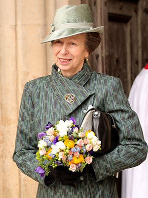 Princess Anne carrying a bouquet of flowers