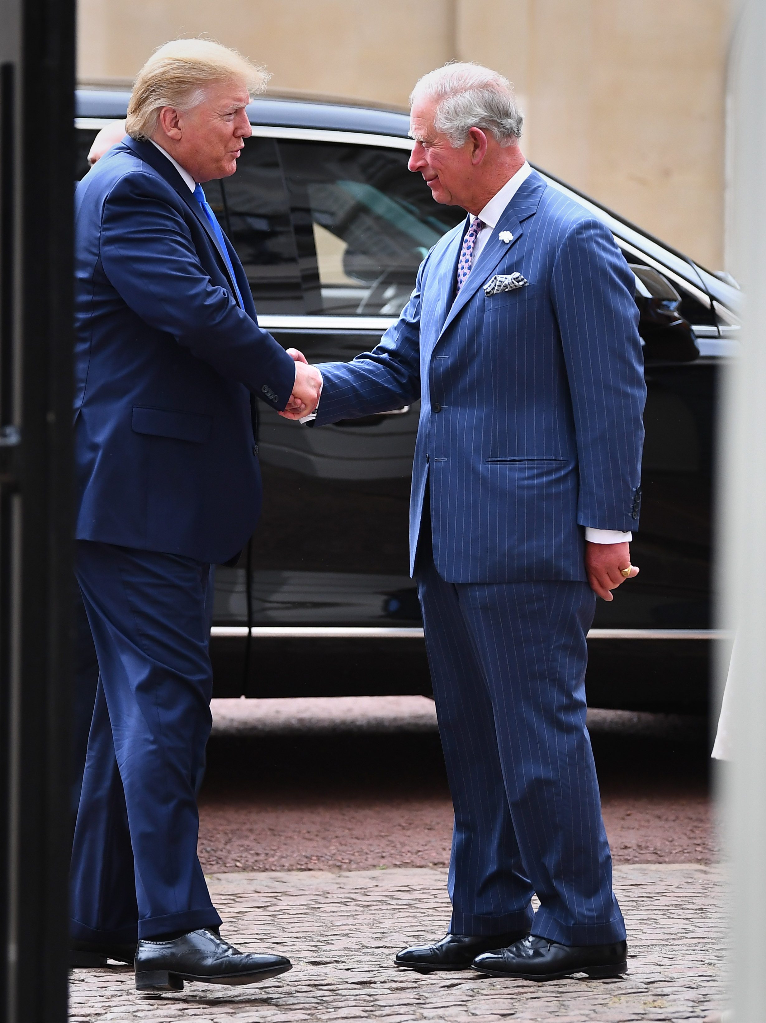 LONDON, ENGLAND - JUNE 03: U.S. President Donald Trump shakes hands with Prince Charles, Prince of Wales as he arrives for tea at Clarence House on June 3, 2019 in London, England. President Trump's three-day state visit will include lunch with the Queen, and a State Banquet at Buckingham Palace, as well as business meetings with the Prime Minister and the Duke of York, before travelling to Portsmouth to mark the 75th anniversary of the D-Day landings.  (Photo by Victoria Jones - WPA Pool/Getty Images)
