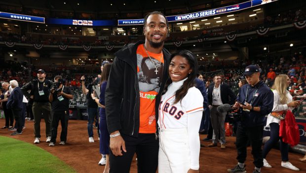 HOUSTON, TX - OCTOBER 28: Olympic gold medalist Simone Biles and Houston Texans safety Jonathan Owens are seen prior to Game 1 of the 2022 World Series between the Philadelphia Phillies and the Houston Astros at Minute Maid Park on Friday, October 28, 2022 in Houston, Texas. (Photo by Mary DeCicco/MLB Photos via Getty Images)