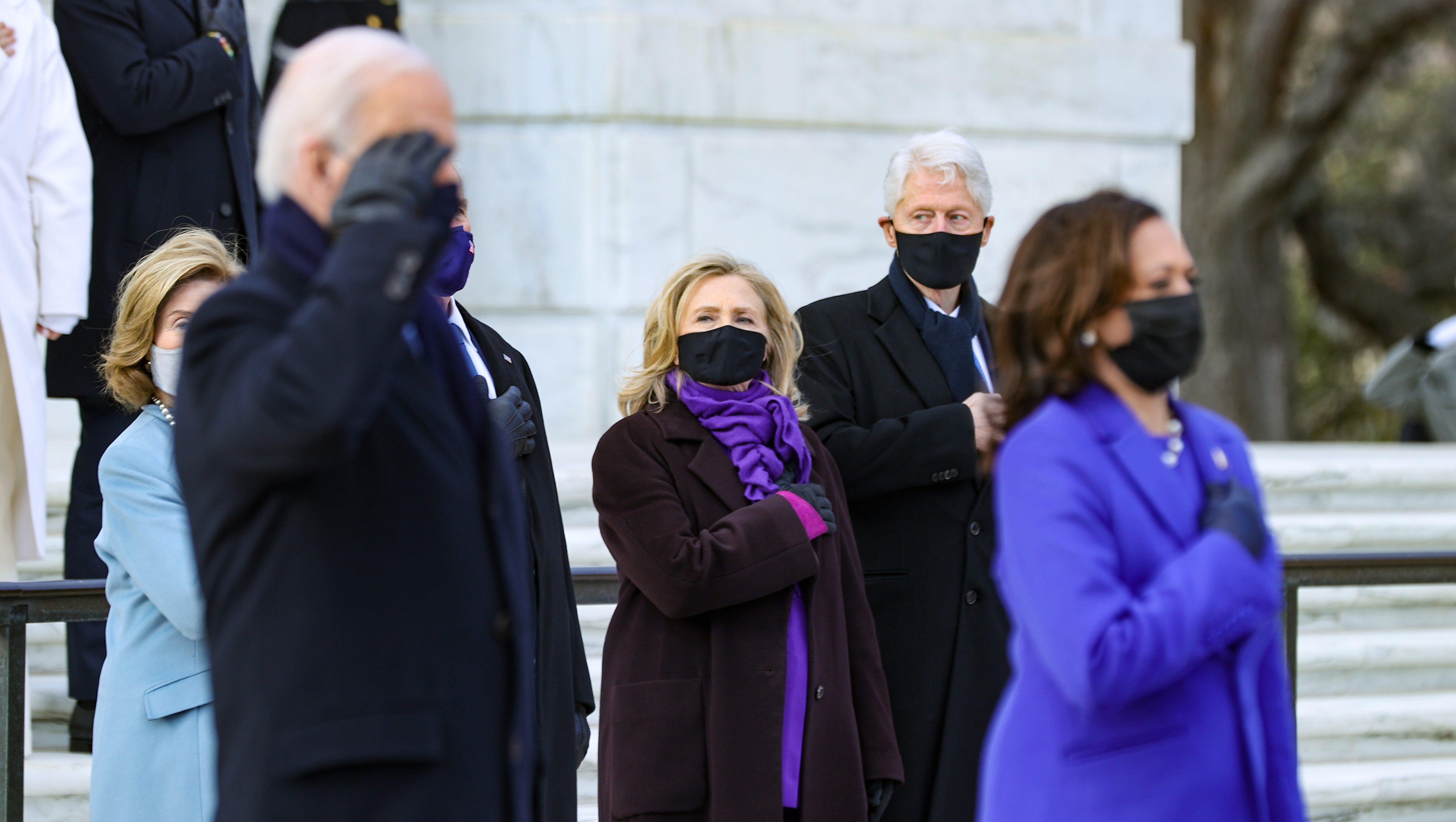 ARLINGTON, VA - JANUARY 20:   U.S. President Joe Biden and Vice President Kamala Harris attend a wreath-laying ceremony at Arlington National Cemetery's Tomb of the Unknown Soldier after the 59th Presidential Inauguration ceremony at the U.S. Capitol, as former U.S. President George W. Bush and Laura Bush, and former U.S. President Bill Clinton and former Secretary of State Hillary Clinton look on,  January 20, 2021  in Arlington, Virginia. During today's inauguration ceremony Joe Biden becomes the 46th president of the United States.   (Photo by Chip Somodevilla/Getty Images)