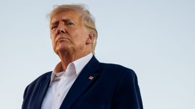 Donald Trump looks on during a rally at the Waco Regional Airport