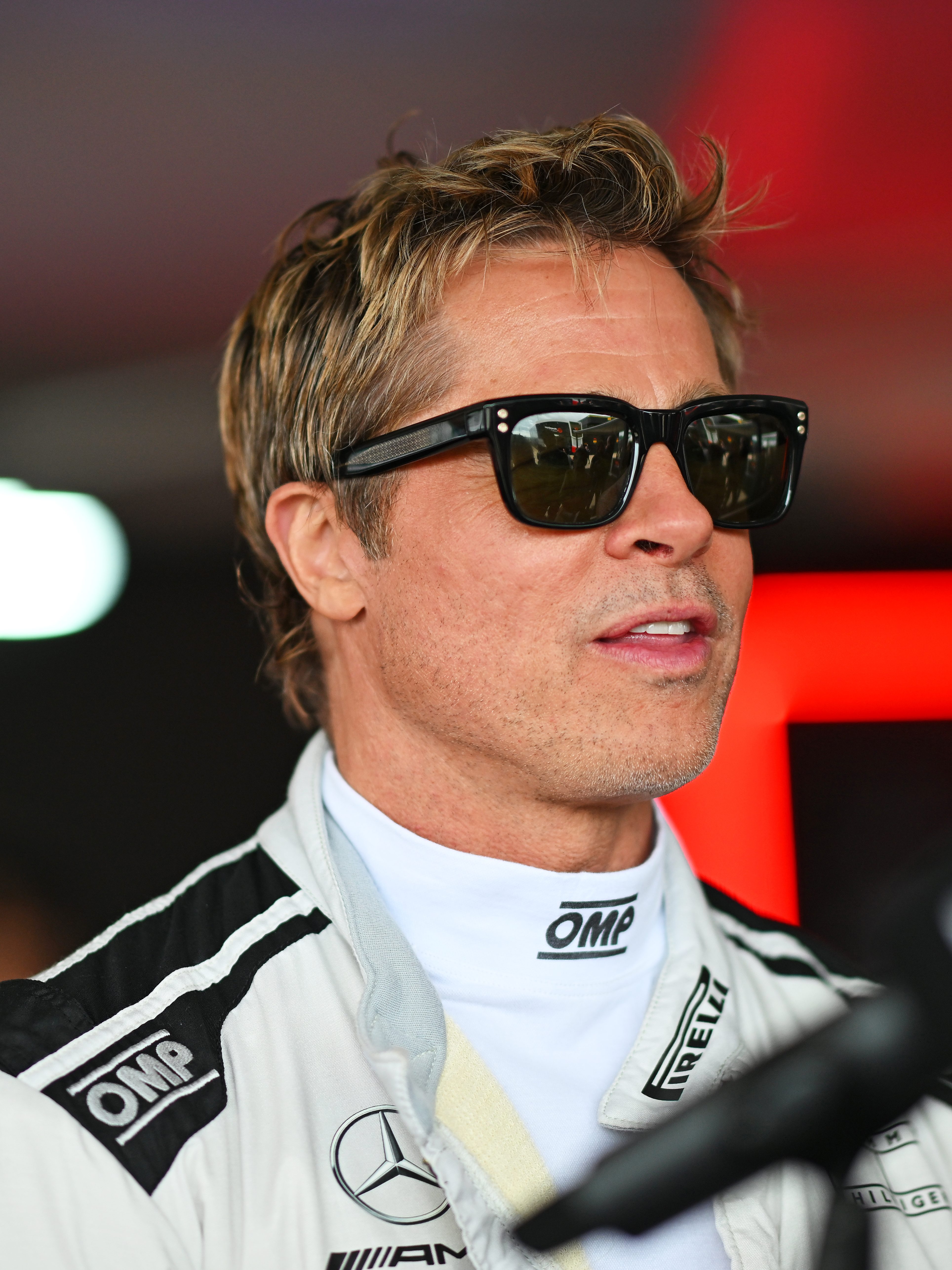 NORTHAMPTON, ENGLAND - JULY 04: Brad Pitt, star of the upcoming Formula One based movie, talks to the media in the Paddock during previews ahead of the F1 Grand Prix of Great Britain at Silverstone Circuit on July 04, 2024 in Northampton, England. (Photo by Rudy Carezzevoli/Getty Images)