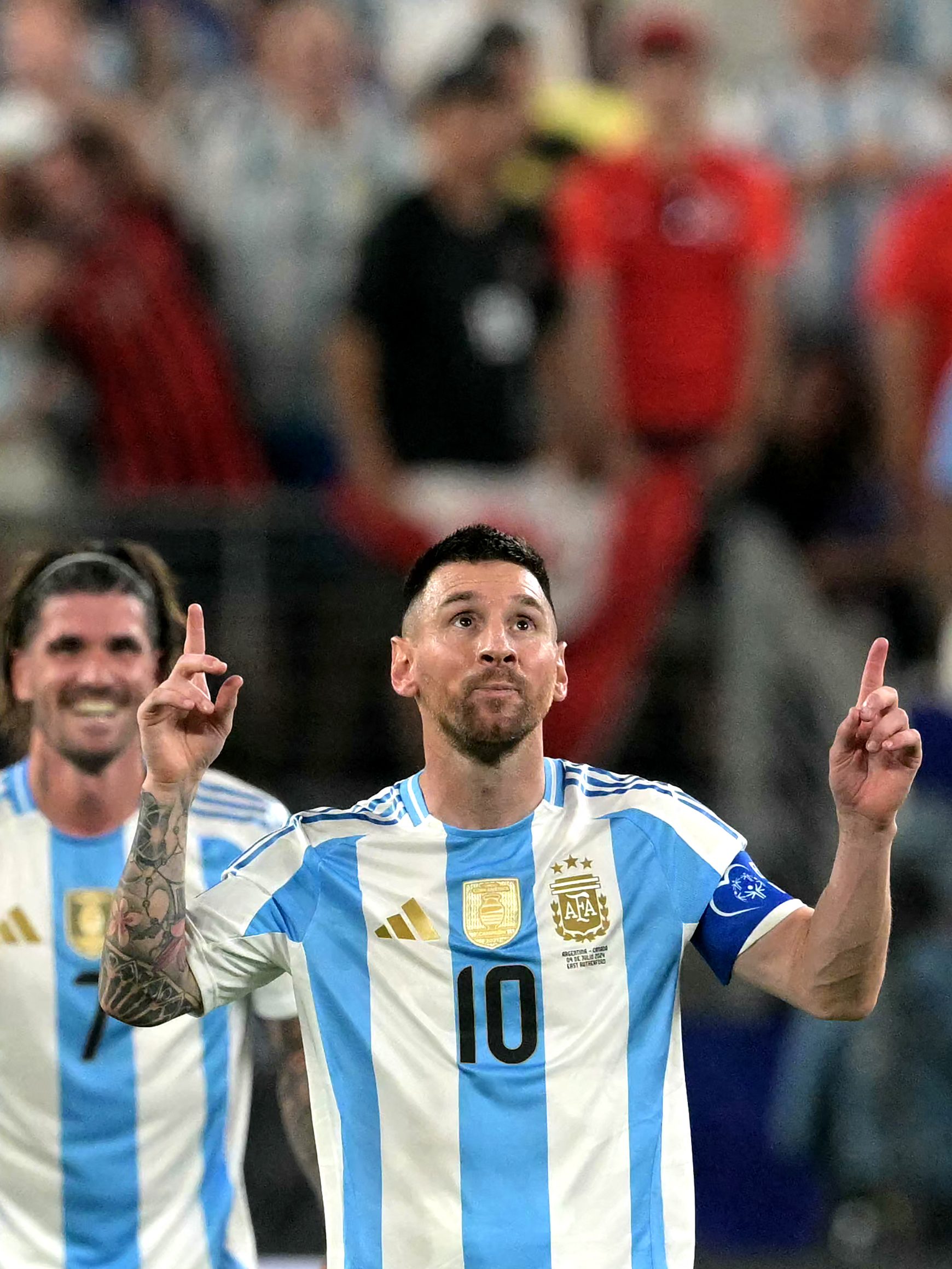 Argentina's forward #10 Lionel Messi celebrates scoring his team's second goal with teammates during the Conmebol 2024 Copa America tournament semi-final football match between Argentina and Canada at MetLife Stadium, in East Rutherford, New Jersey on July 9, 2024. (Photo by JUAN MABROMATA / AFP) (Photo by JUAN MABROMATA/AFP via Getty Images)