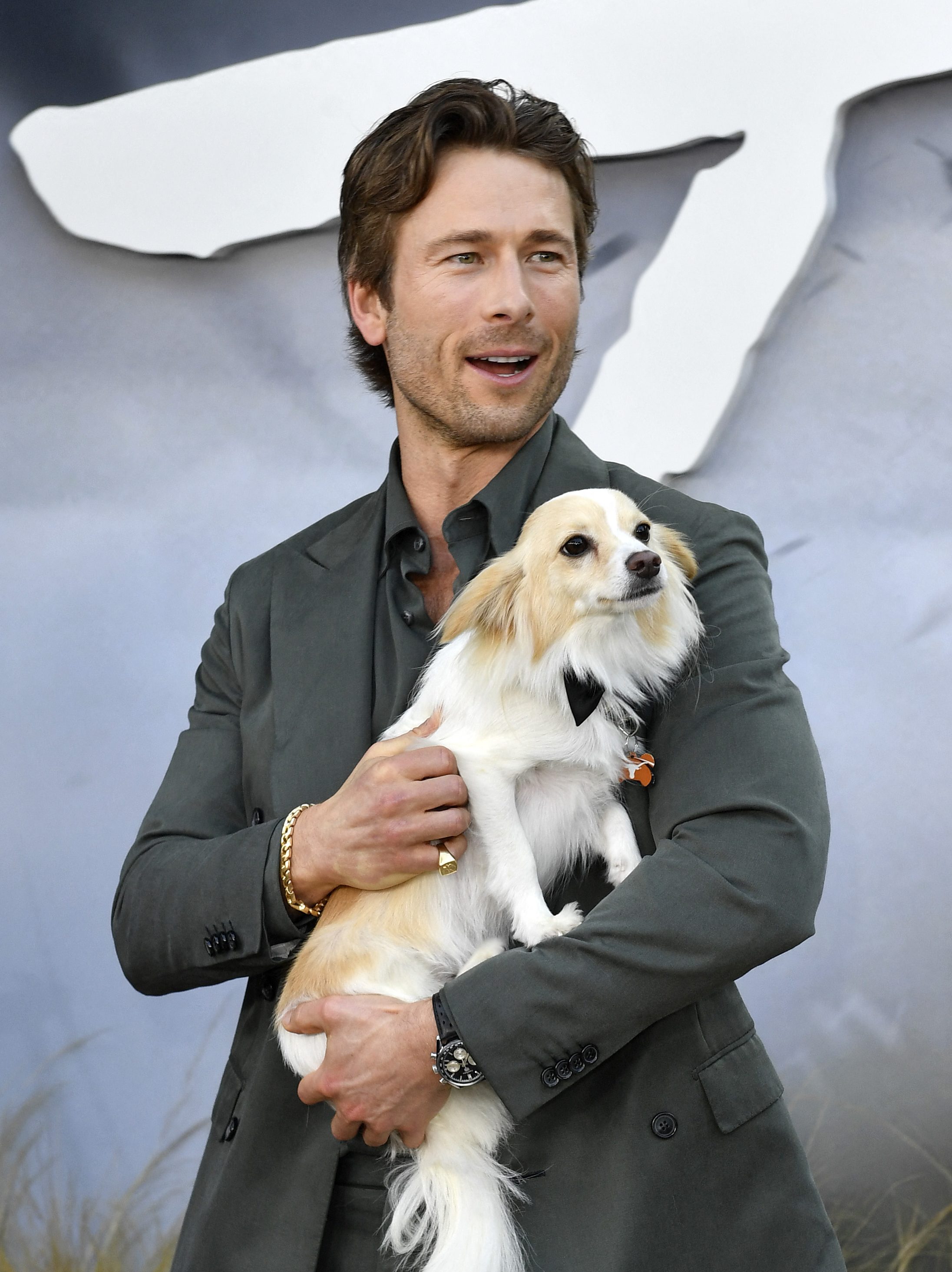 Glen Powell and his dog Brisket attend Universal's "Twisters" premiere