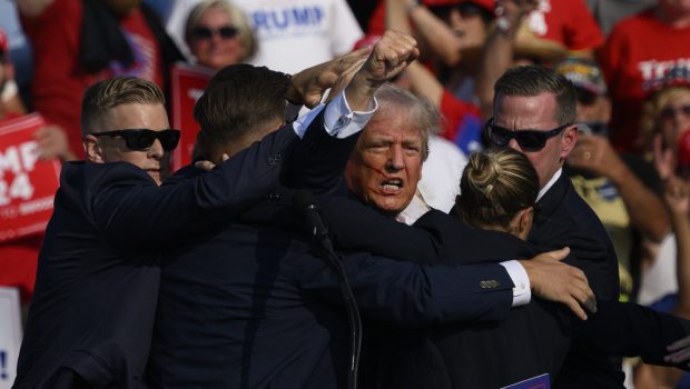 Donald Trump is whisked away by Secret Service after shots rang out at a campaign rally