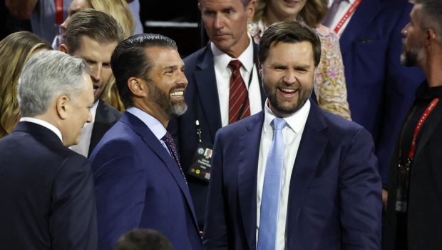 US Senator from Ohio and 2024 Republican vice-president candidate J. D. Vance (R) chats with Donald Trump Jr. (C) during the first day of the 2024 Republican National Convention at the Fiserv Forum in Milwaukee, Wisconsin, July 15, 2024. Donald Trump won formal nomination as the Republican presidential candidate and picked a right-wing loyalist for running mate, kicking off a triumphalist party convention in the wake of last weekend's failed assassination attempt. (Photo by KAMIL KRZACZYNSKI / AFP) (Photo by KAMIL KRZACZYNSKI/AFP via Getty Images)