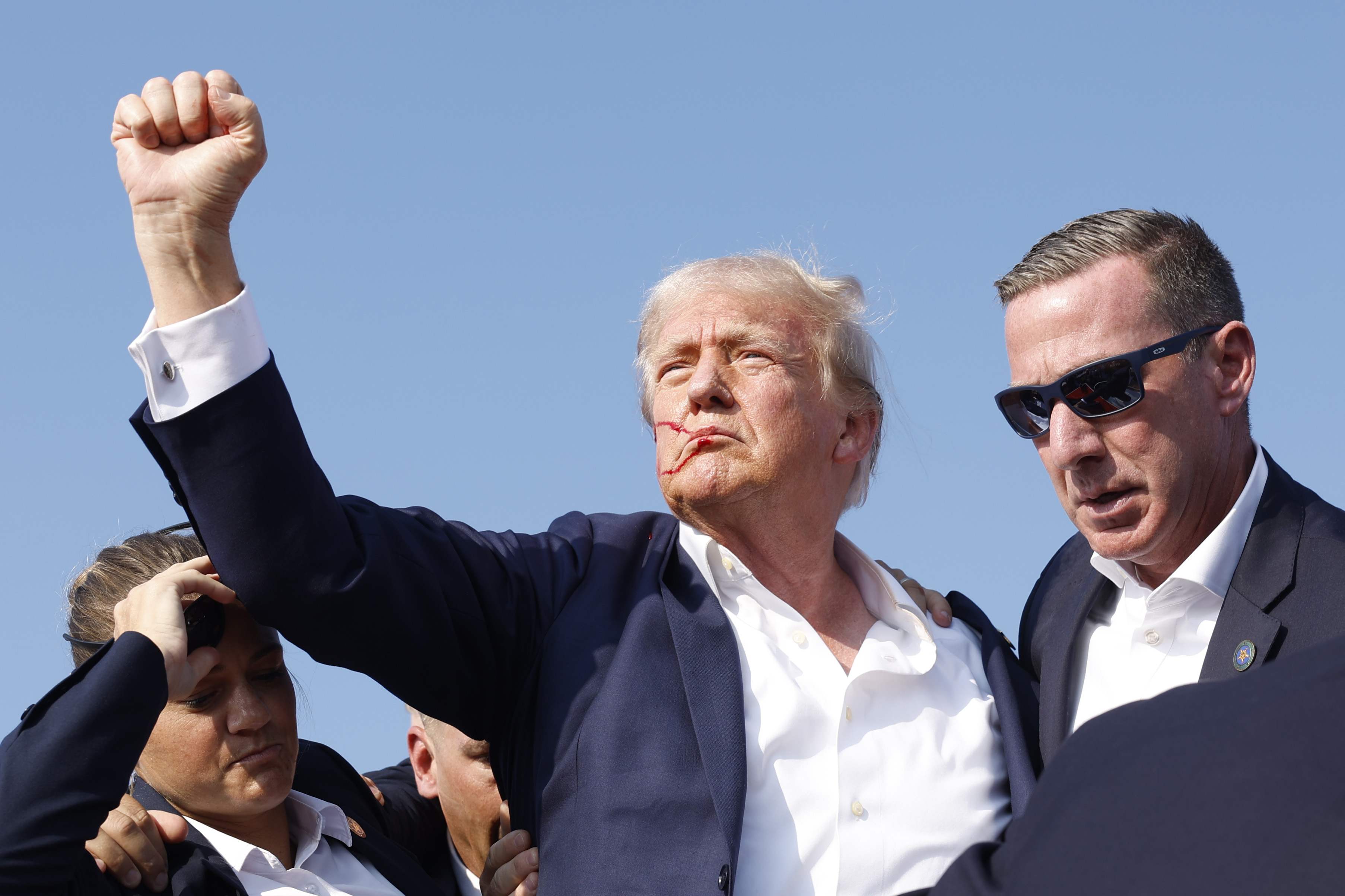 BUTLER, PENNSYLVANIA - JULY 13: Republican presidential candidate former President Donald Trump is rushed offstage during a rally on July 13, 2024 in Butler, Pennsylvania. (Photo by Anna Moneymaker/Getty Images)