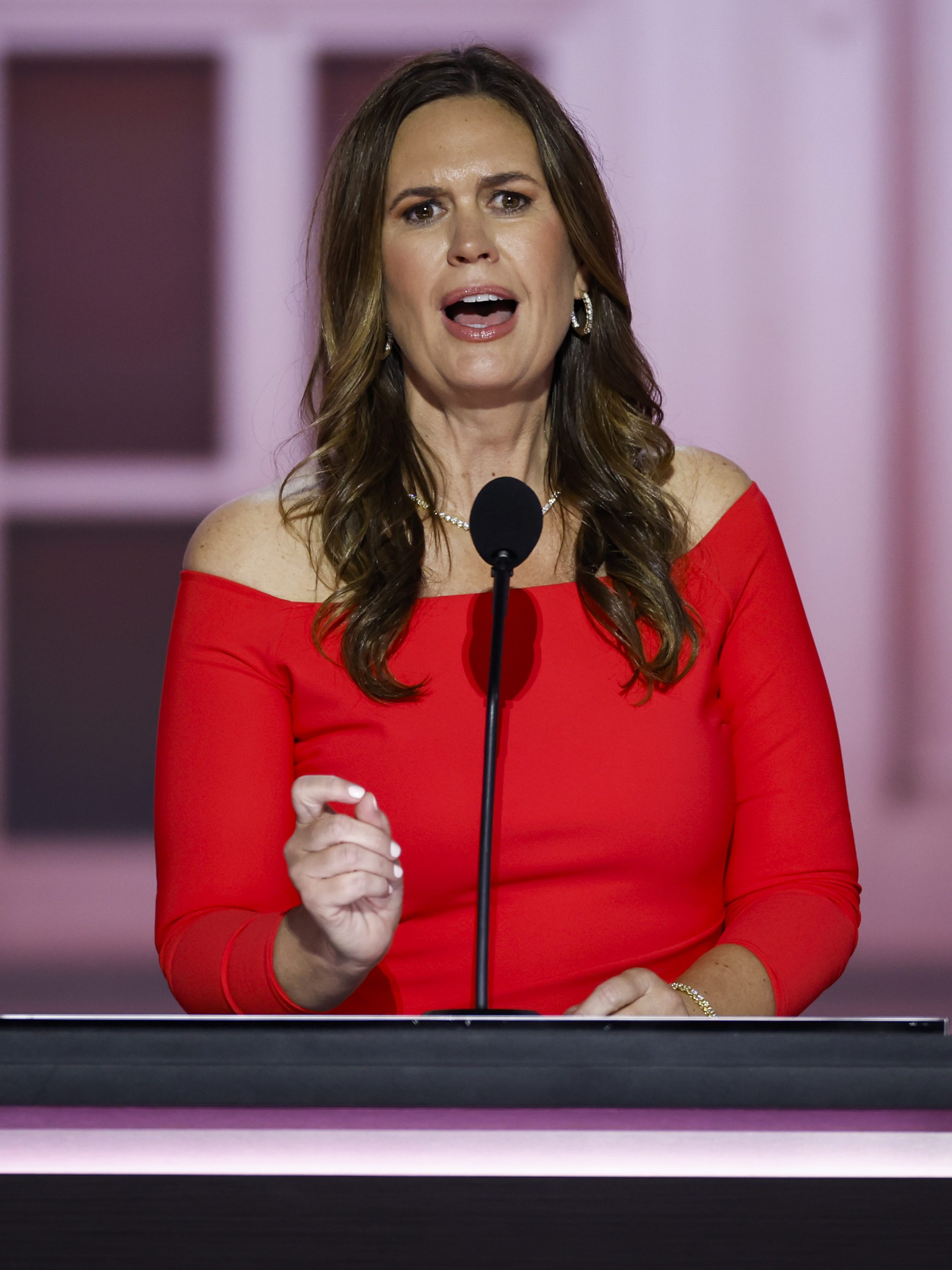 MILWAUKEE, WISCONSIN - JULY 16: Arkansas Gov. Sarah Huckabee Sanders speaks on stage on the second day of the Republican National Convention at the Fiserv Forum on July 16, 2024 in Milwaukee, Wisconsin. Delegates, politicians, and the Republican faithful are in Milwaukee for the annual convention, concluding with former President Donald Trump accepting his party's presidential nomination. The RNC takes place from July 15-18. (Photo by Chip Somodevilla/Getty Images)