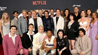 LOS ANGELES, CALIFORNIA - JULY 17: (L-R) Peyton List, Gianni DeCenzo, Daniel Kim, Martin Kove, Yuji Okumoto, Jacob Bertrand, William Zabka, Josh Heald, Tanner Buchanan, Ralph Macchio, Dallas Dupree Young, Jon Hurwitz, Hayden Schlossberg, Griffin Santopietro, Caleeb Pinkett, Vanessa Rubio, Mary Mouser, Bret Ernst, Xolo Maridueña, Courtney Henggeler, Oona O'Brien, Hannah Kepple and Dan Ahdoot attend Cobra Kai Season 6 Part 1 - Special Fan Event at Autry Museum at Griffith Park on July 17, 2024 in Los Angeles, California.  (Photo by Charley Gallay/Getty Images for Netflix)