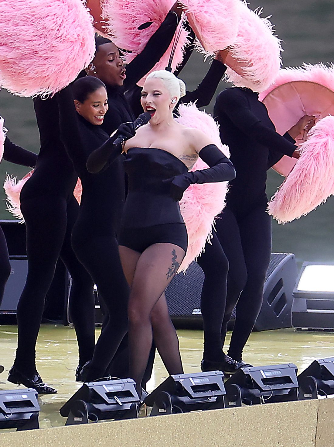Lady Gaga performs at Square Barye during the athletes parade on the River Seine