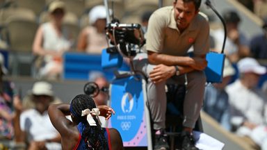 US' Coco Gauff speaks with chair umpire Jaume Campistol after a call goes against her while playing Croatia's Donna Vekic during their women's singles third round tennis match on Court Philippe-Chatrier at the Roland-Garros Stadium during the Paris 2024 Olympic Games, in Paris on July 30, 2024. (Photo by PATRICIA DE MELO MOREIRA / AFP) (Photo by PATRICIA DE MELO MOREIRA/AFP via Getty Images)