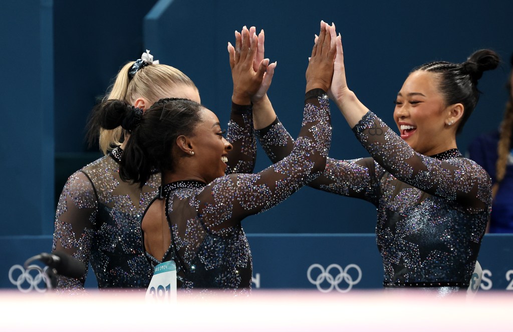 PARIS, FRANCE - JULY 28: Simone Biles celebrates with teammate Sunisa Lee of Team United States during the Artistic Gymnastics Women's Qualification on day two of the Olympic Games Paris 2024 at Bercy Arena on July 28, 2024 in Paris, France. (Photo by Jamie Squire/Getty Images)