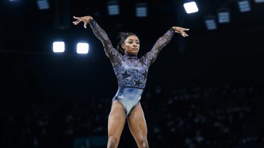 Simone Biles competing on balance beam in Paris