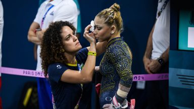 PARIS, FRANCE - JULY 30: Flavia Saraiva of Team Brazil receives medical treatment during the Artistic Gymnastics Women's Team Final on day four of the Olympic Games Paris 2024 at the Bercy Arena on July 30, 2024 in Paris, France. (Photo by Tom Weller/VOIGT/GettyImages)