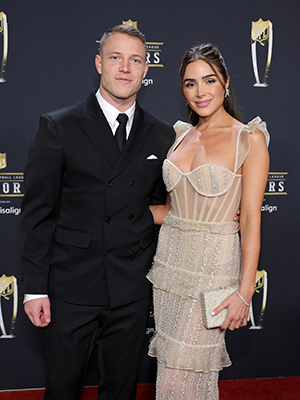 Olivia Culpo and Christian McCaffrey at event.