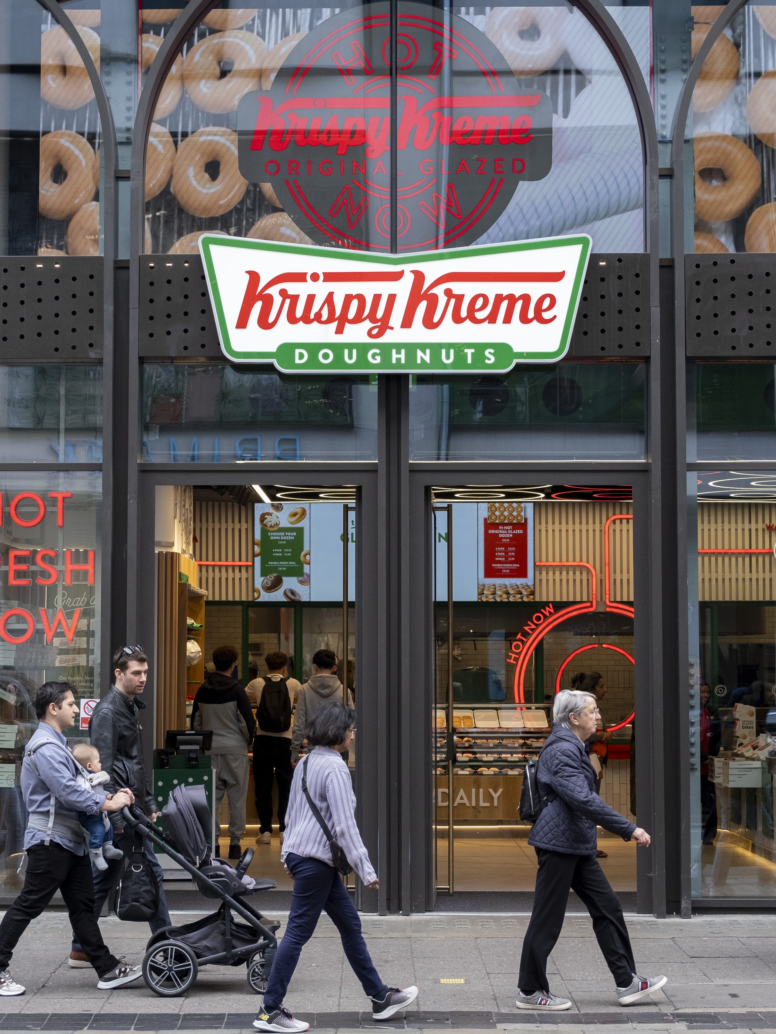 People outside Krispy Kreme, their new store on Oxford Street on 9th June 2024 in London, United Kingdom. Krispy Kreme, previously known as Krispy Kreme Doughnuts, Inc is an American multinational doughnut company and coffeehouse chain. (photo by Mike Kemp/In Pictures via Getty Images)