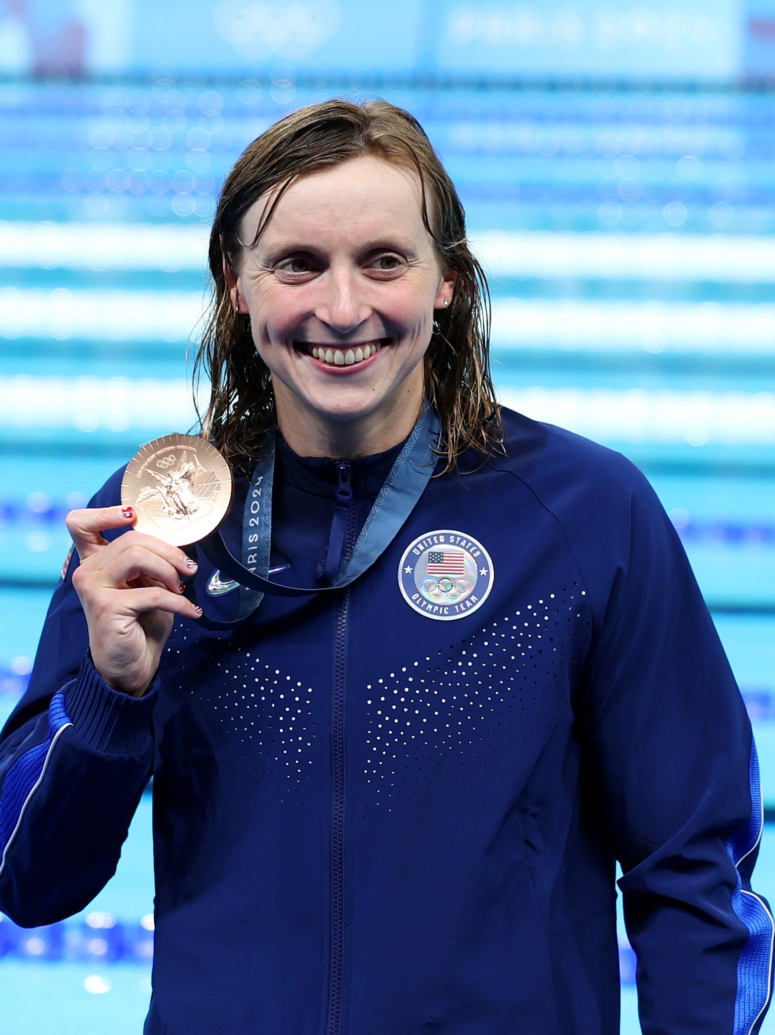 NANTERRE, FRANCE - JULY 27: Bronze Medalist, Katie Ledecky  of Team United States poses with her medal following the Medal Ceremony after the Women's 400m Freestyle Final on day one of the Olympic Games Paris 2024 at Paris La Defense Arena on July 27, 2024 in Nanterre, France. (Photo by Sarah Stier/Getty Images)