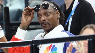 PARIS, FRANCE - JULY 28: Snoop Dogg (R) attends the Artistic Gymnastics Women's Qualification on day two of the Olympic Games Paris 2024 at Bercy Arena on July 28, 2024 in Paris, France. (Photo by Arturo Holmes/Getty Images)