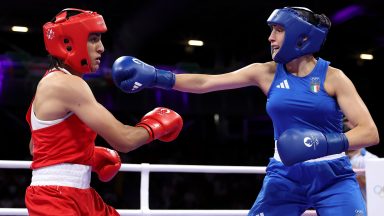 PARIS, FRANCE - AUGUST 01: Imane Khelif of Team Algeria dodges a punch from  Angela Carini of Team Italy during the Women's. 66kg preliminary round match on day six of the Olympic Games Paris 2024 at North Paris Arena on August 01, 2024 in Paris, France. (Photo by Richard Pelham/Getty Images)