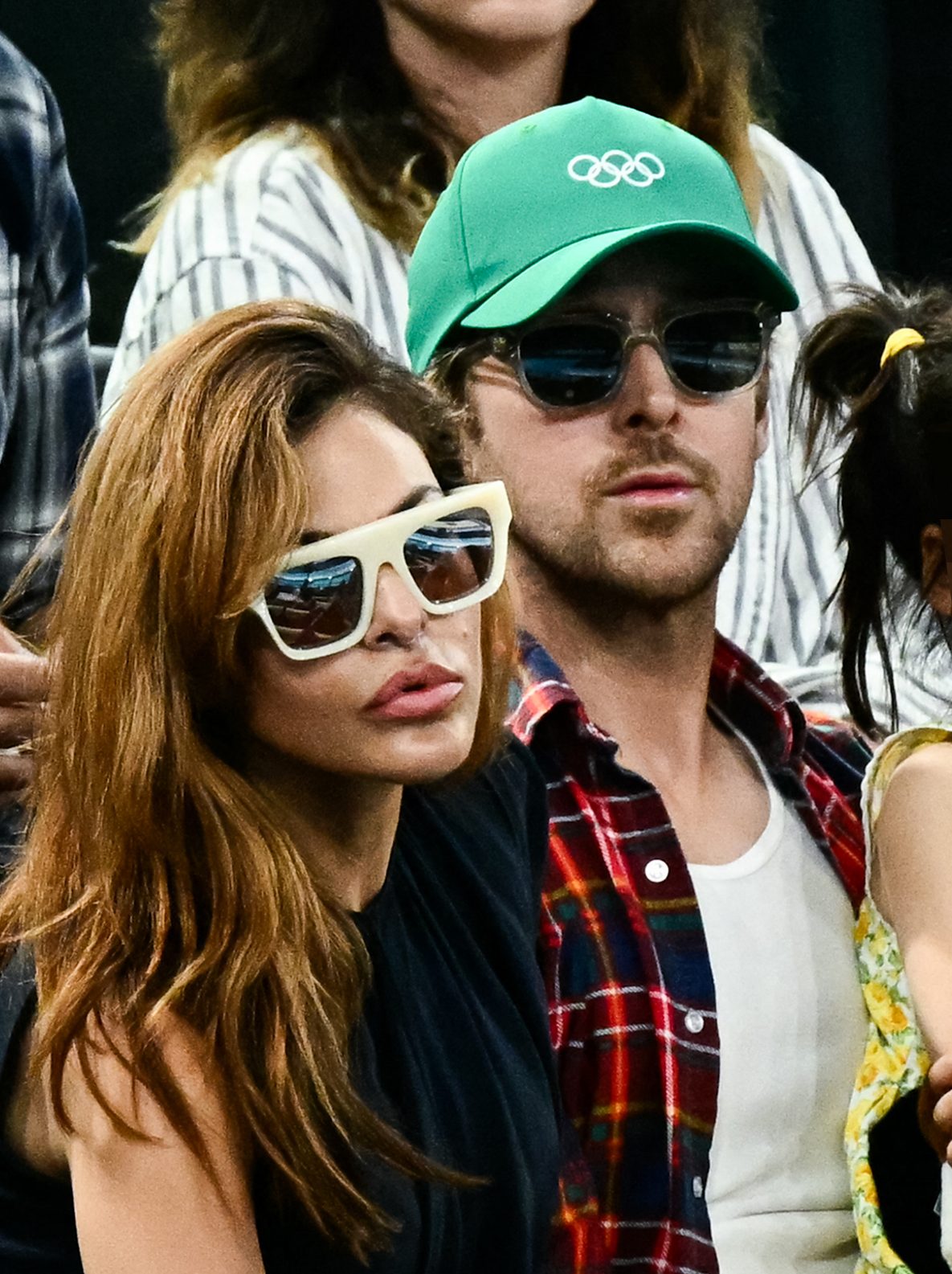 Eva Mendes and Ryan Gosling attend the artistic gymnastics women's uneven bars final