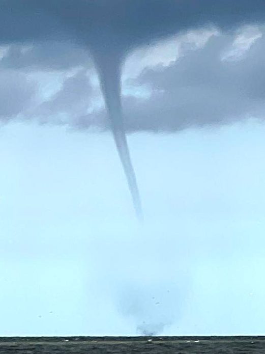 08 August 2024, Lower Saxony, Borkum: The photo taken by a fishing boat shows a suspected tornado off the North Sea island of Borkum. A suspected tornado has caused minor devastation on the beach of the North Sea island of Borkum. On Thursday, the tornado moved from the sea over a section of the west beach and on to the promenade, as can be seen in videos on the internet. Photo: Rolf Groenewold/dpa (Photo by Rolf Groenewold/picture alliance via Getty Images)