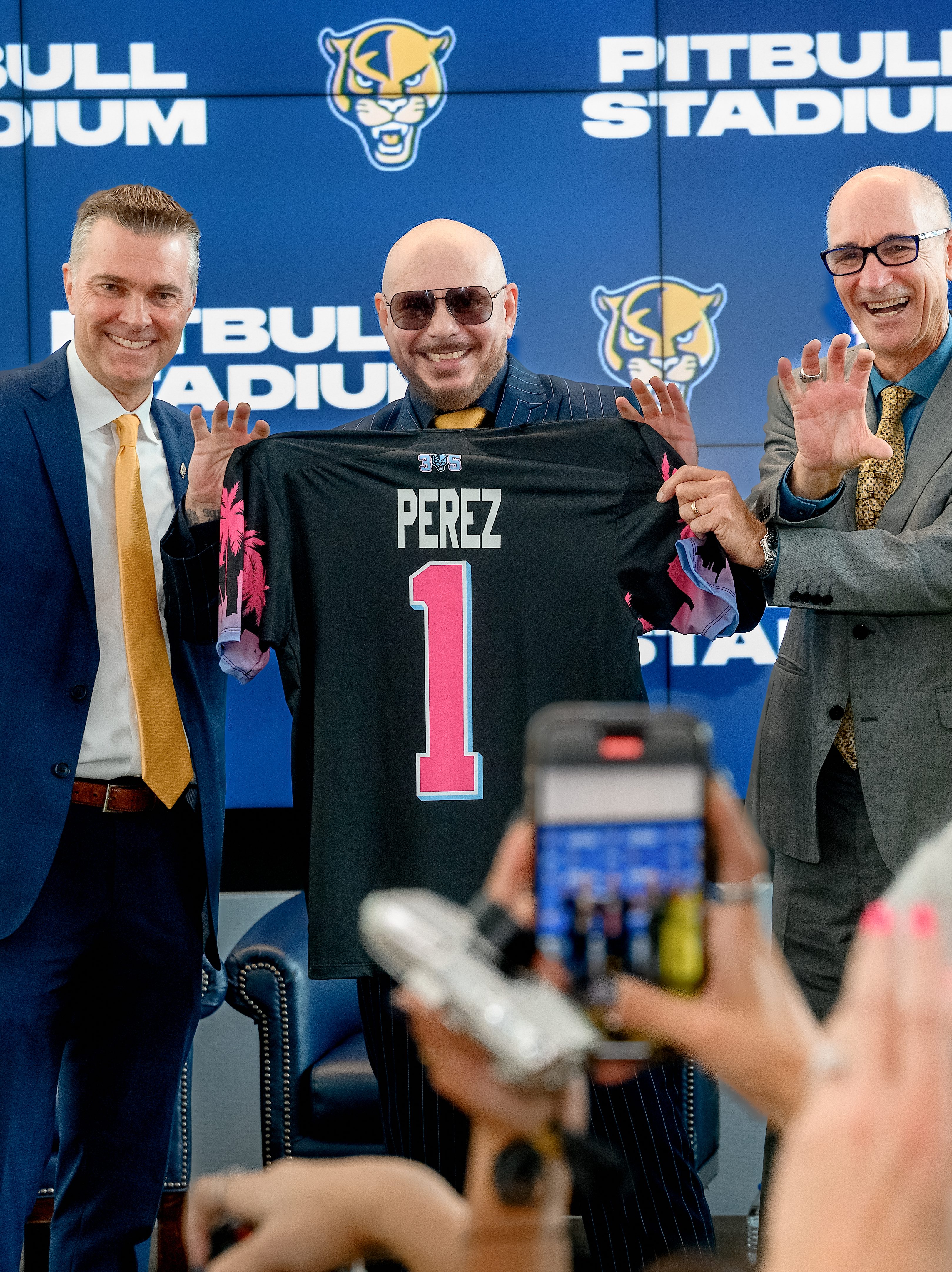 MIAMI, FLORIDA - AUGUST 06: Scott Carr, Pitbull, Kenneth Jessell, and Lucy Benedetti pose during the FIU Pitbull Stadium announcement at Tamiami Hall at Florida International University on August 06, 2024 in Miami, Florida. (Photo by Ivan Apfel/Getty Images)