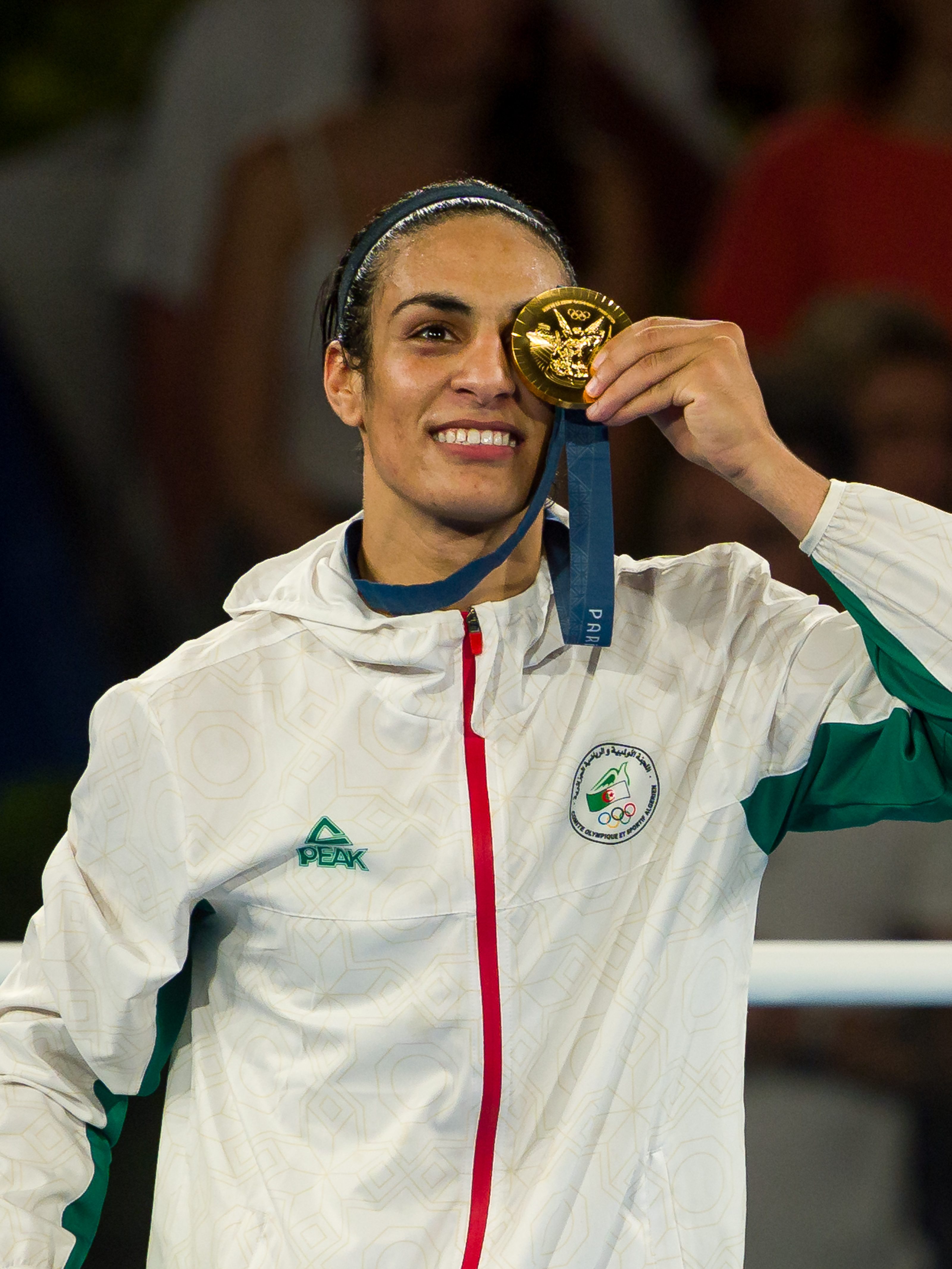 PARIS, FRANCE - AUGUST 09: Gold Medallist Imane Khelif of Team Algeria celebrates during the Boxing Women's 66kg medal ceremony after the Boxing Women's 66kg Final match on day fourteen of the Olympic Games Paris 2024 at Roland Garros on August 09, 2024 in Paris, France. (Photo by Andy Cheung/Getty Images)