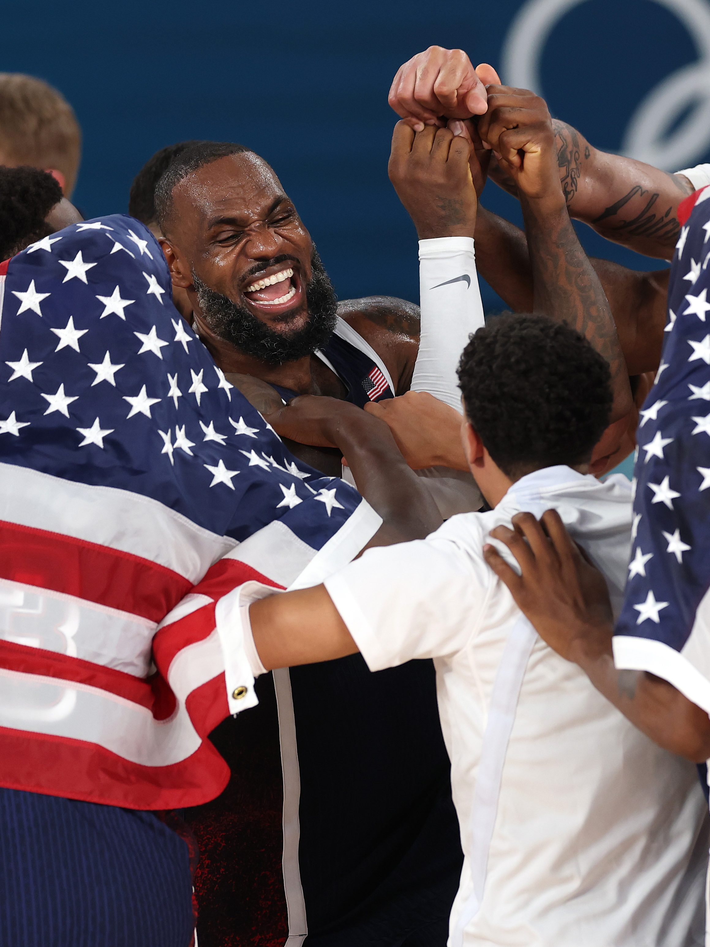 PARIS, FRANCE - AUGUST 10: LeBron James #6 of Team United States celebrates with teammates after their victory against Team France during the Men's Gold Medal game between Team France and Team United States on day fifteen of the Olympic Games Paris 2024 at Bercy Arena on August 10, 2024 in Paris, France. (Photo by Jamie Squire/Getty Images)