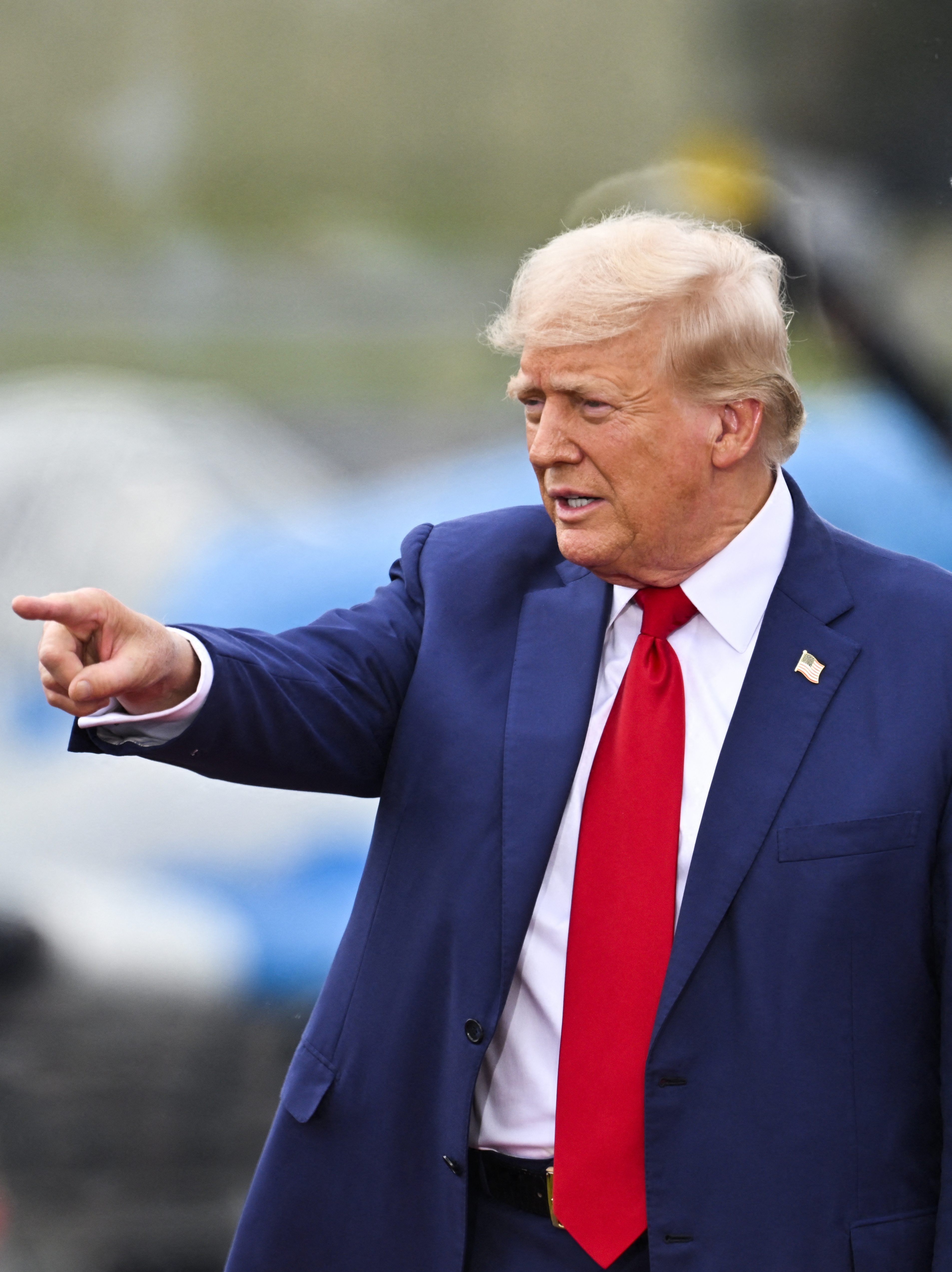 Former US President and Republican presidential candidate Donald Trump points after speaking about national security during a campaign rally at the North Carolina Aviation Museum & Hall of Fame in Asheboro, North Carolina, August 21, 2024. (Photo by Peter Zay / AFP) (Photo by PETER ZAY/AFP via Getty Images)