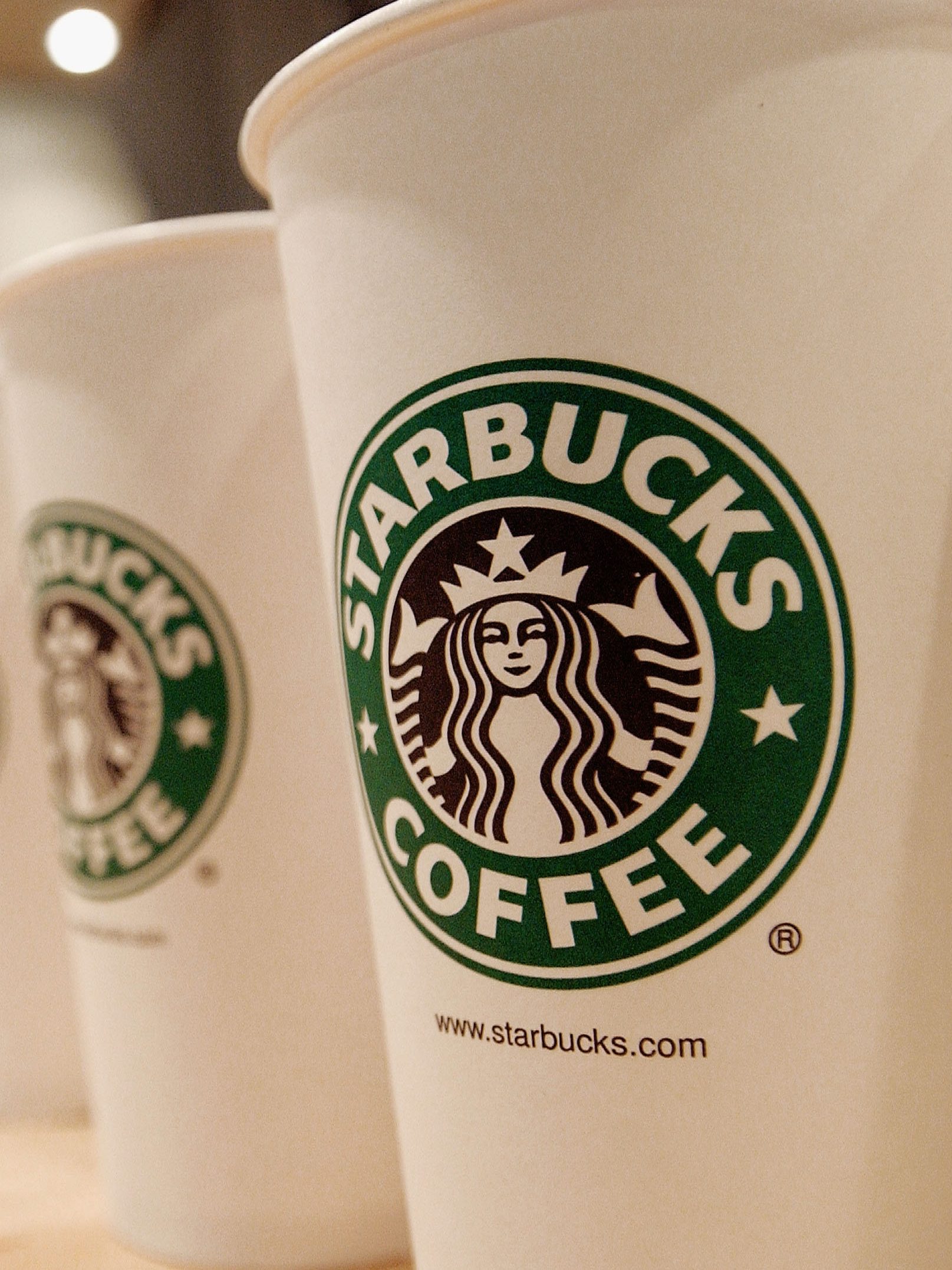 Beverage cups featuring the logo of Starbucks Coffee