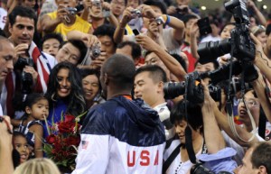 USA's Kobe Bryant (C) celebrates with his wife Vanessa (L) after the men's basketball gold medal match of the Beijing 2008 Olympic Games on August 24, 2008 at the Olympic basketball Arena in Beijing. The United States won the Olympic men's basketball gold medal defeating Spain 118-107. Argentina defeated Lithuania 87-75 in the bronze-medal game. AFP PHOTO / TIMOTHY A. CLARY (Photo credit should read TIMOTHY A. CLARY/AFP via Getty Images)