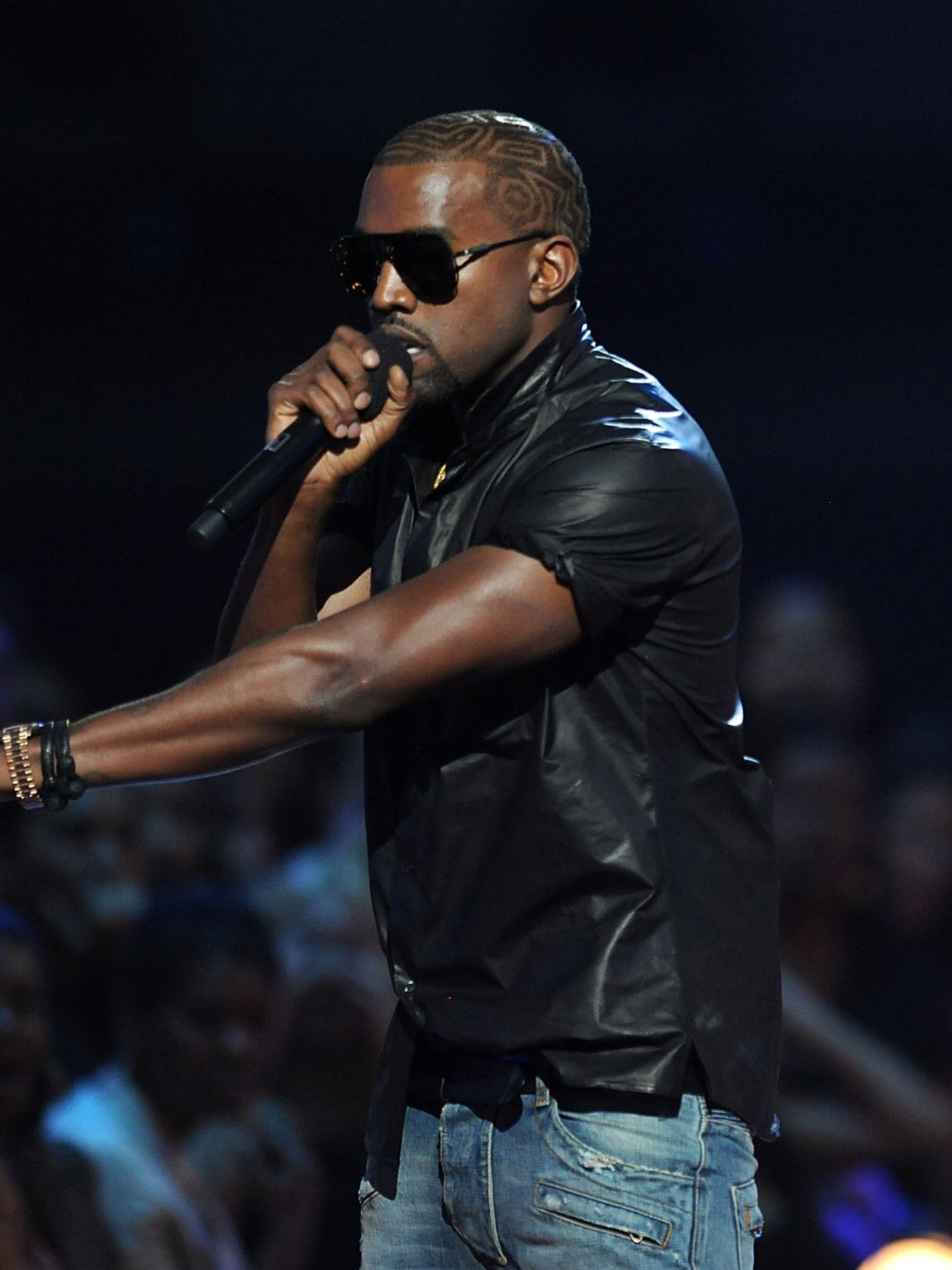Kanye West takes the microphone from Taylor Swift