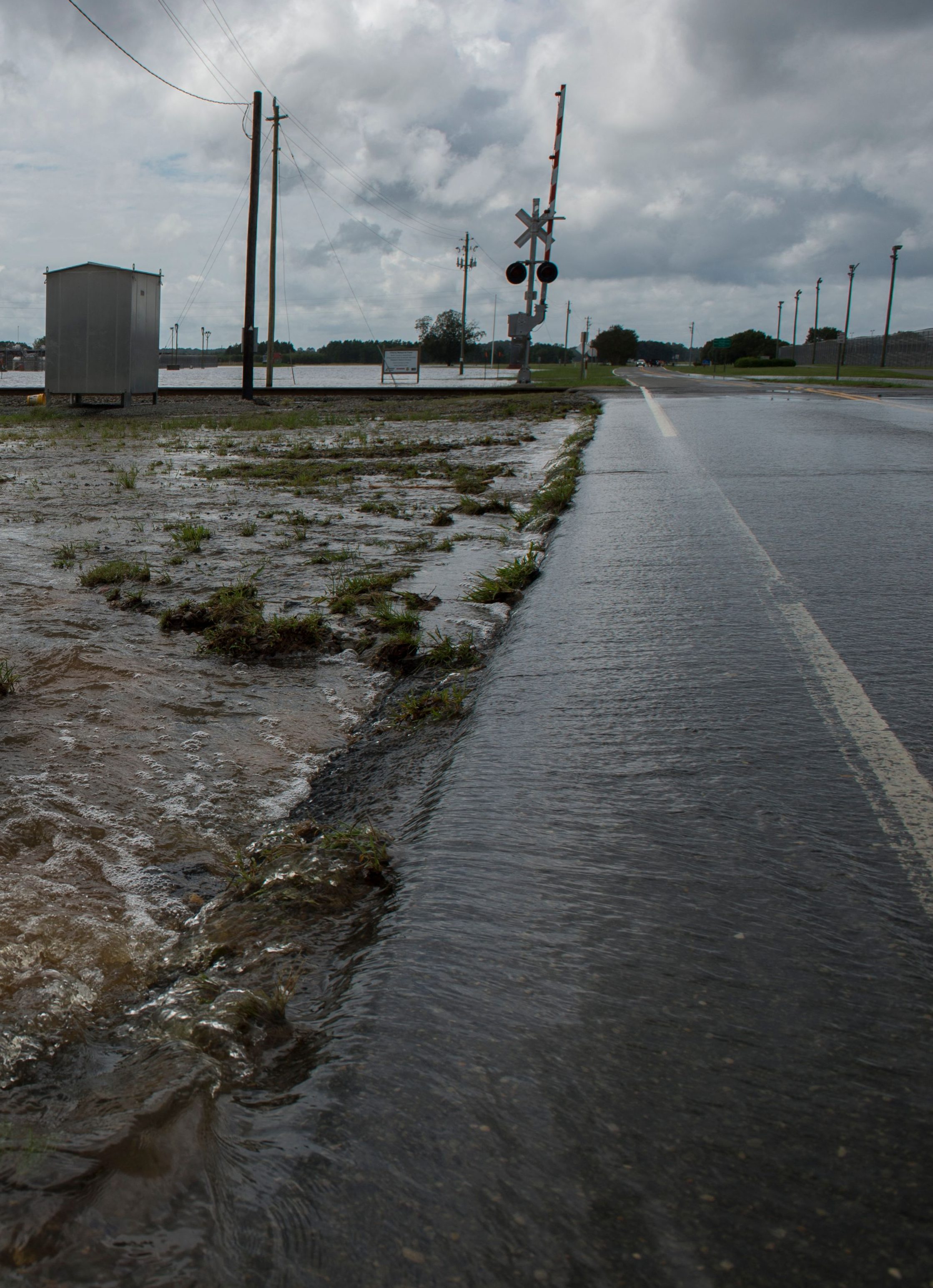 Floodwaters rise outside a prison in Goldsborough, North Carolina on September 17, 2018. - Catastrophic floods raised the threat of landslides and dam failures across the southeastern United States on Monday, prolonging the agony caused by a killer hurricane that has left more than a dozen people dead and caused billions of dollars in damage. Downgraded to a tropical depression, Florence crept over South and North Carolina, dumping heavy rains on already flood-swollen river basins that authorities warned could bring more death and destruction. (Photo by Andrew CABALLERO-REYNOLDS / AFP) (Photo by ANDREW CABALLERO-REYNOLDS/AFP via Getty Images)