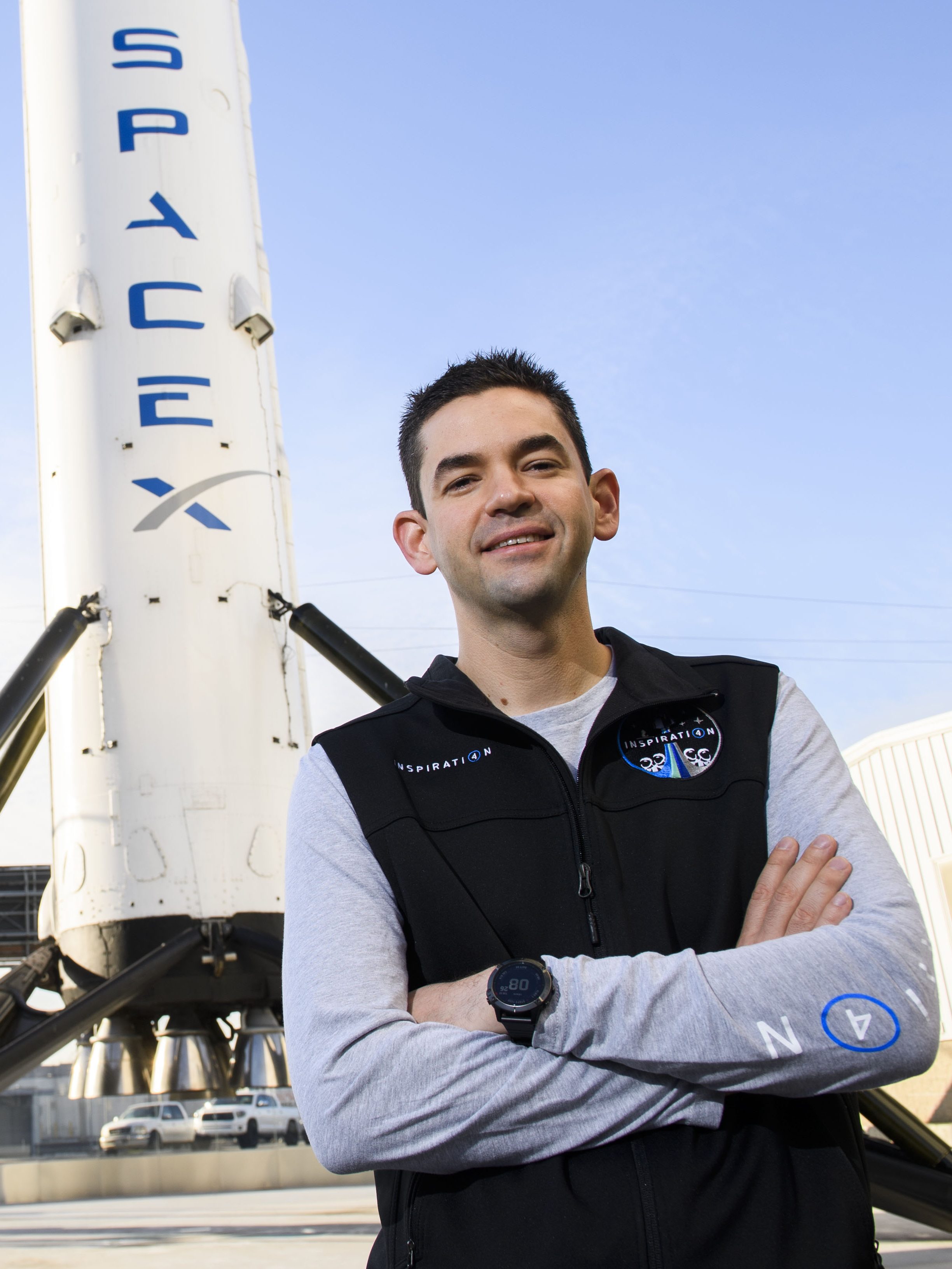Inspiration4 mission commander Jared Isaacman, founder and chief executive officer of Shift4 Payments, stands for a portrait in front of the recovered first stage of a Falcon 9 rocket at Space Exploration Technologies Corp. (SpaceX) on February 2, 2021 in Hawthorne, California. - Isaacman's all-civilian Inspiration4 mission will raise $200 million for St. Jude Children's Research Hospital through a donation based sweepstakes to select a member of the crew. (Photo by Patrick T. FALLON / AFP) (Photo by PATRICK T. FALLON/AFP via Getty Images)
