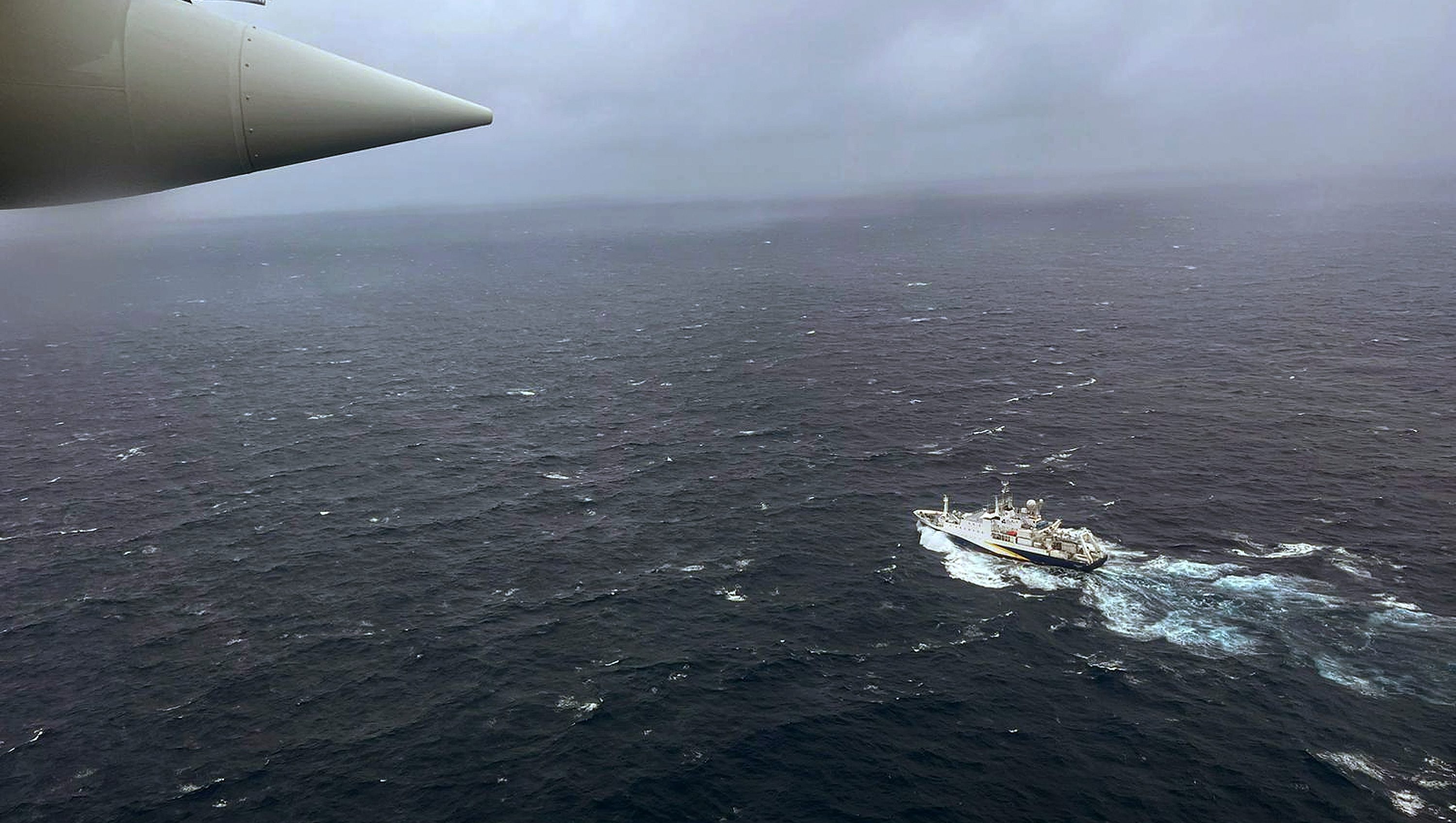 ATLANTIC OCEAN - JUNE 21: In this U.S. Coast Guard handout, a Coast Guard Air Station Elizabeth City, North Carolina HC-130 Hercules airplane flies over the French research vessel, L'Atalante approximately 900 miles East of Cape Cod during the search for the 21-foot submersible, Titan, June 21, 2023 over the Atlantic Ocean. The unified command is searching for five people after the Canadian research vessel Polar Prince lost contact with their submersible during a dive to the wreck of the Titanic on June 18, 2023. (Photo by U.S. Coast Guard via Getty Images)