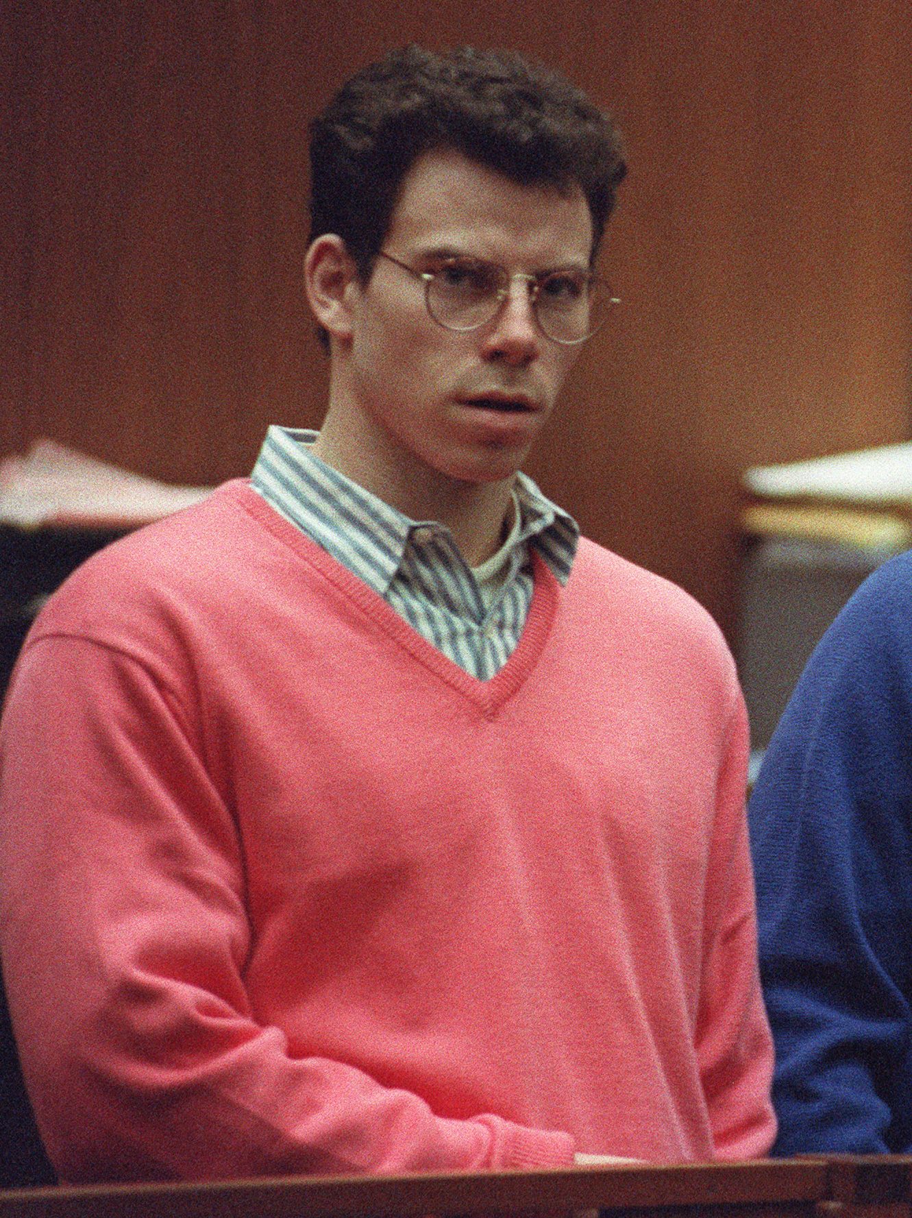 Erik Menendez (L) and his brother Lyle (R) listen during a pre-trial hearing, on December 29, 1992 in Los Angeles after the two pleaded innocent in the August 1989 shotgun deaths of their wealthy parents, Jose and Mary Louise Menendez of Beverly Hills, Calif. It took 40 months for the Superior Court arraignment after prosecutors and defense attorneys battled over the admissibility of taped confessions the brothers allegedly made to their psychotherapist. AFP PHOTO VINCE BUCCI (Photo by VINCE BUCCI / AFP) (Photo by VINCE BUCCI/AFP via Getty Images)