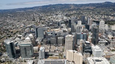 SAN FRANCISCO, CALIFORNIA - MAY 30: An aerial view of downtown Oakland on May 30, 2023 in Oakland, California. (Photo by Brandon Sloter/Getty Images)