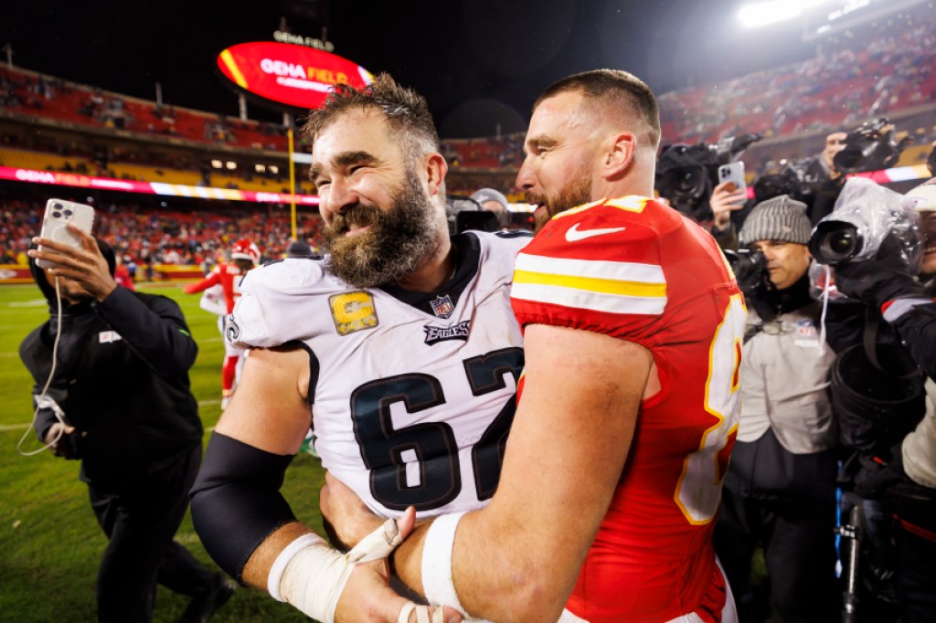 KANSAS CITY, MISSOURI - NOVEMBER 20: Jason Kelce #62 of the Philadelphia Eagles and Travis Kelce #87 of the Kansas City Chiefs embrace after an NFL football game against the Kansas City Chiefs at GEHA Field at Arrowhead Stadium on November 20, 2023 in Kansas City, Missouri. (Photo by Ryan Kang/Getty Images)