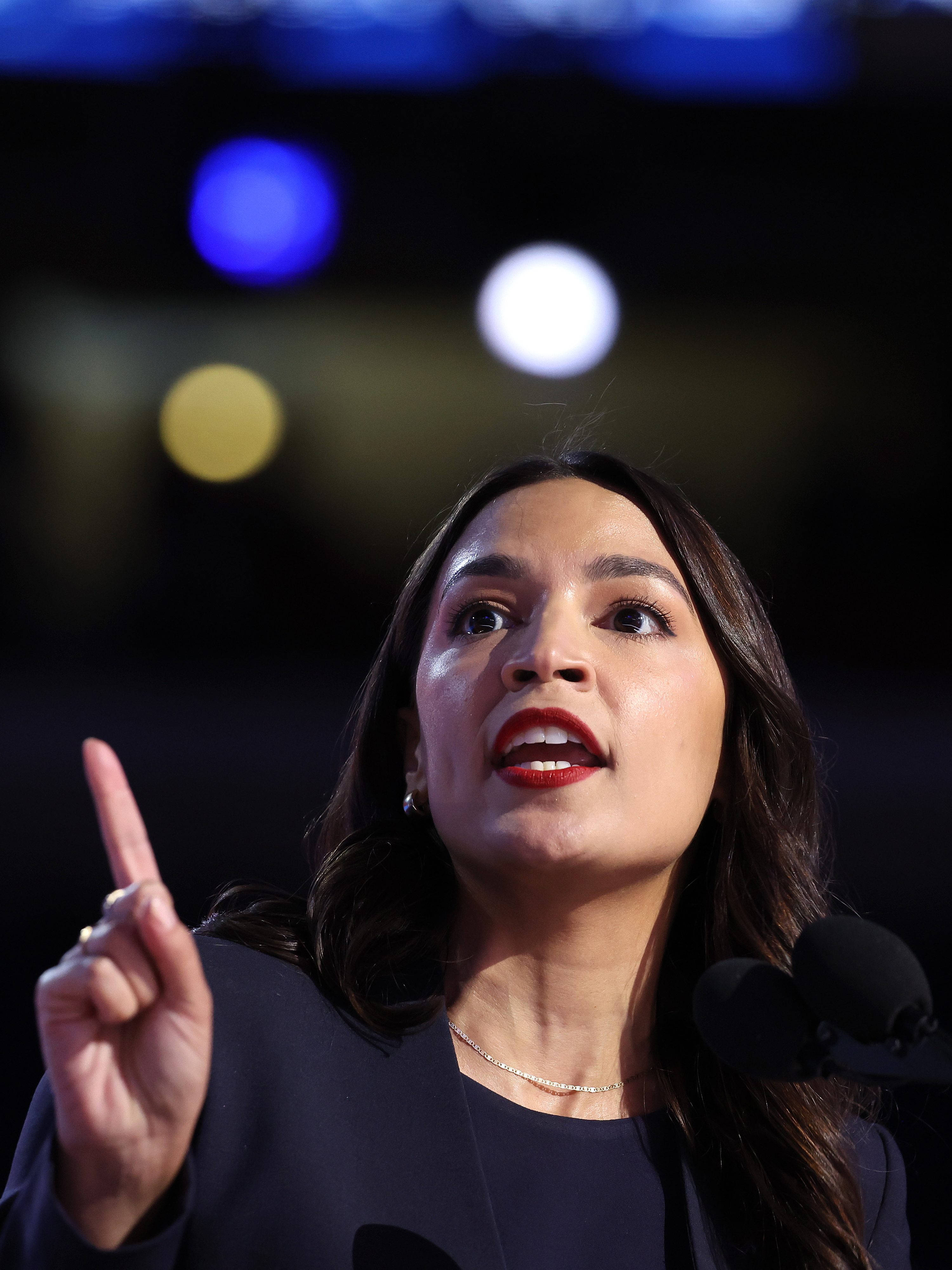 CHICAGO, ILLINOIS - AUGUST 19: Rep. Alexandria Ocasio-Cortez (D-NY) speaks onstage during the first day of the Democratic National Convention at the United Center on August 19, 2024 in Chicago, Illinois.  Delegates, politicians, and Democratic party supporters are in Chicago for the convention, concluding with current Vice President Kamala Harris accepting her party's presidential nomination. The DNC takes place from August 19-22. (Photo by Justin Sullivan/Getty Images)