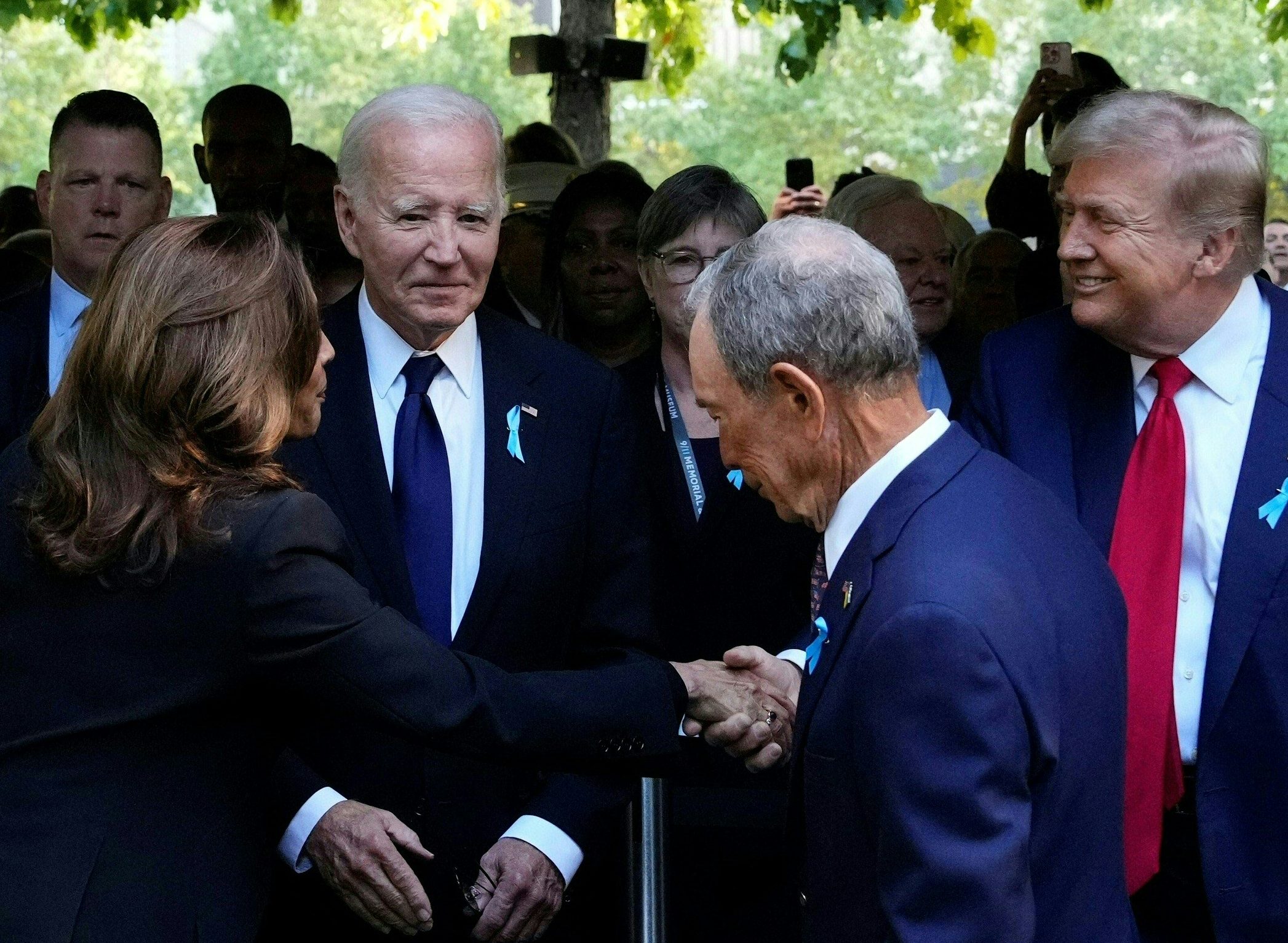Kamala Harris shakes hands with Donald Trump