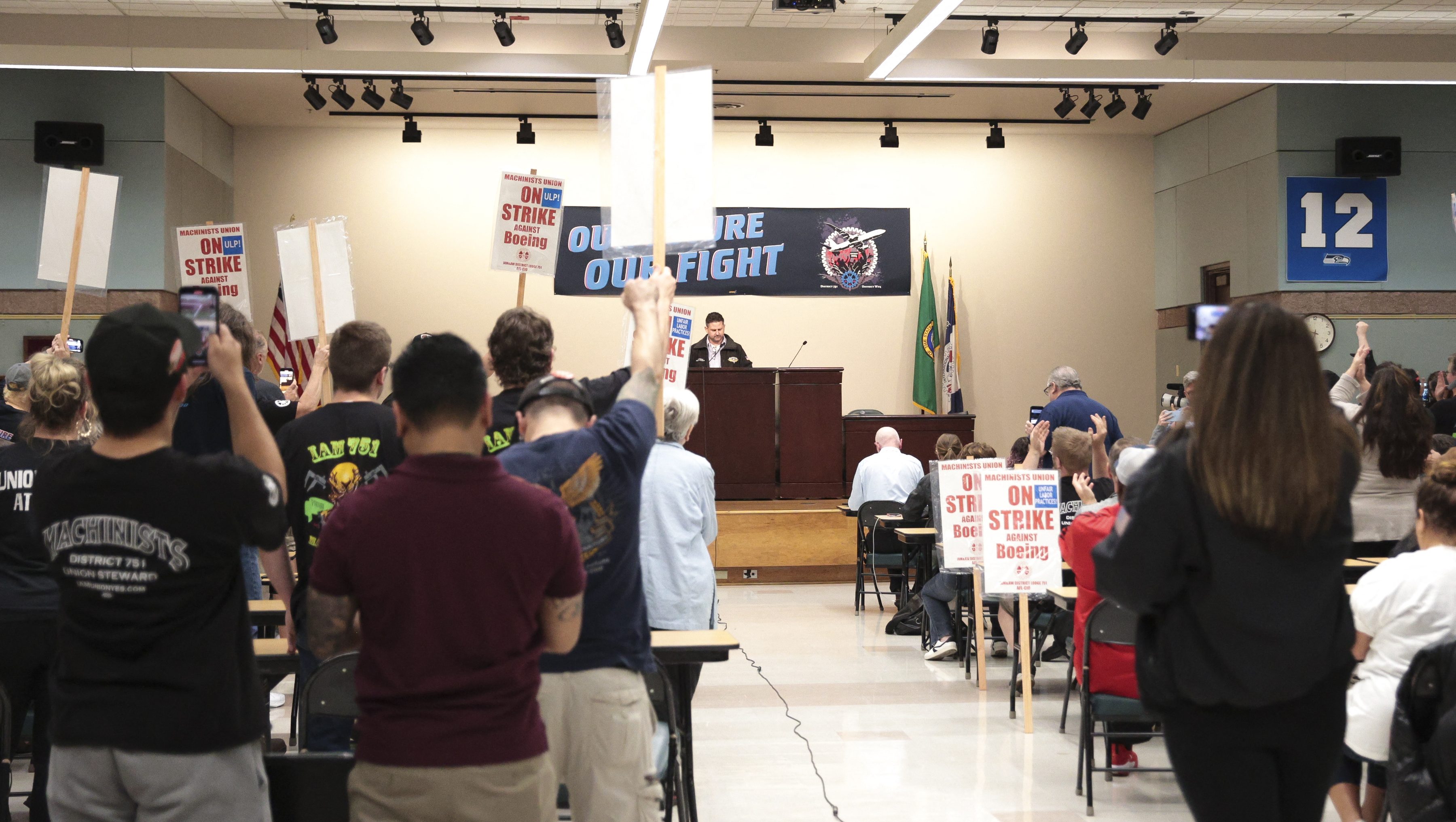 Aerospace Machinists District 751 President Jon Holden announces that union members have rejected a proposed Boeing contract and will go on strike, following voting results at their union hall in Seattle, Washington, on September 12, 2024. Boeing workers in the Seattle region overwhelmingly voted to strike on September 12, rejecting a contract the embattled aviation giant characterized as a boon for staff given the company's stressed financial condition. (Photo by Jason Redmond / AFP) (Photo by JASON REDMOND/AFP via Getty Images)
