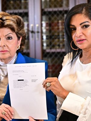 Attorney Gloria Allred and Thalia Graves, an alleged victim of Rap mogul Sean Diddy Combs, hold a copy of a criminal complaint during a press conference in Los Angeles on September 24, 2024. Graves is suing Combs for rape. Combs is imprisoned pending trial on racketeering and sex trafficking charges, after Judge Andrew Carter upheld a ruling on Septemebr 18, that the bail package proposed by his defense team was insufficient given his history of violence and substance abuse, and the possibility of witness tampering. (Photo by Frederic J. Brown / AFP) (Photo by FREDERIC J. BROWN/AFP via Getty Images)