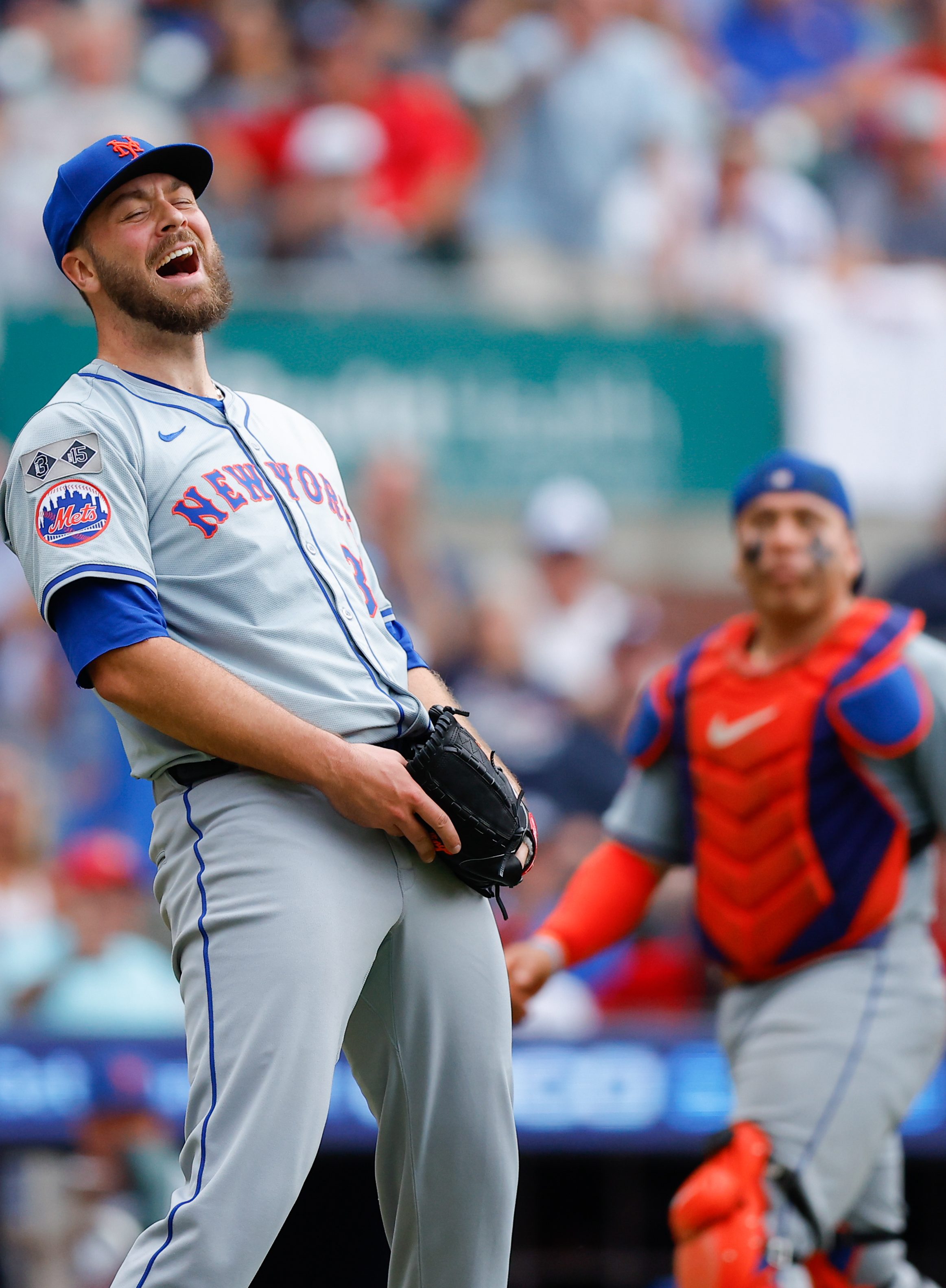 Tylor Megill #38 of the New York Mets reacts after fielding the ball for an out in the fifth inning during the game between the New York Mets and the Atlanta Braves at Truist Park on Monday, September 30, 2024 in Atlanta, Georgia. (Photo by Todd Kirkland/MLB Photos via Getty Images)