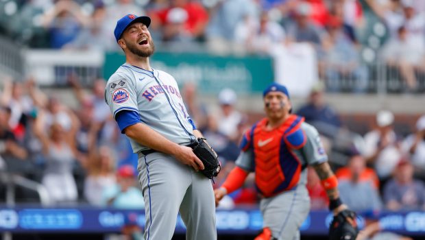 ATLANTA, GA - SEPTEMBER 30: Tylor Megill #38 of the New York Mets reacts after fielding the ball for an out in the fifth inning during the game between the New York Mets and the Atlanta Braves at Truist Park on Monday, September 30, 2024 in Atlanta, Georgia. (Photo by Todd Kirkland/MLB Photos via Getty Images)