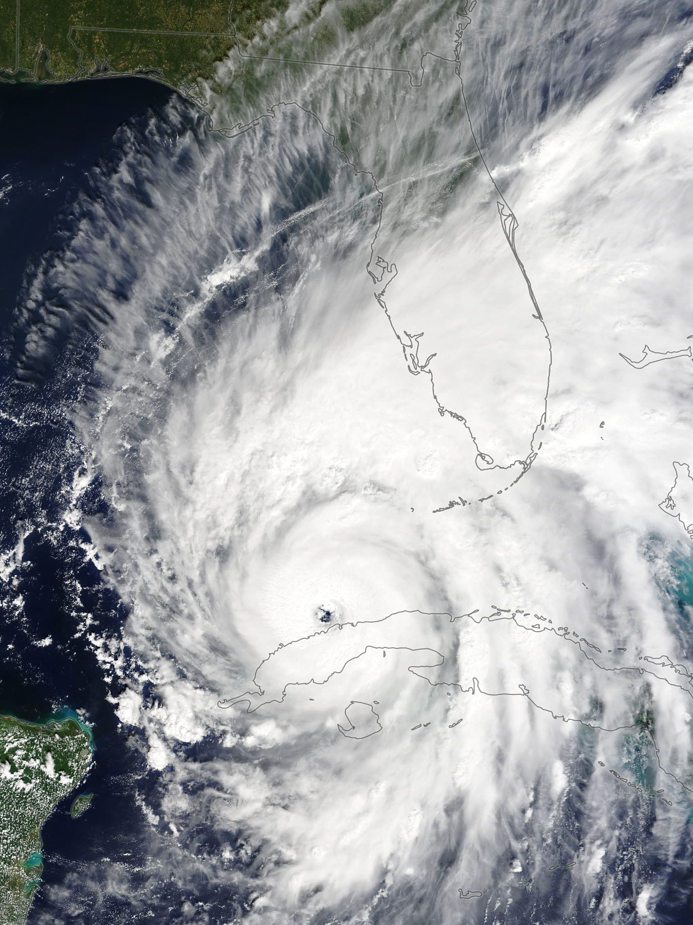 Hurricane Ian enters the Gulf of Mexico at 16:00 UTC on September 27, 2022, just hours after it moved off the northwest coast of Cuba. The storm is expected to bring a potentially life-threatening storm surge and hurricane-force winds. (Photo by NASA via Getty Images)