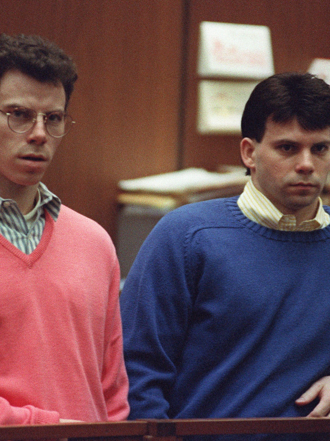 Erik Menendez (L) and his brother Lyle (R) listen during a pre-trial hearing, on December 29, 1992 in Los Angeles after the two pleaded innocent in the August 1989 shotgun deaths of their wealthy parents, Jose and Mary Louise Menendez of Beverly Hills, Calif. It took 40 months for the Superior Court arraignment after prosecutors and defense attorneys battled over the admissibility of taped confessions the brothers allegedly made to their psychotherapist. AFP PHOTO VINCE BUCCI (Photo by VINCE BUCCI / AFP) (Photo by VINCE BUCCI/AFP via Getty Images)