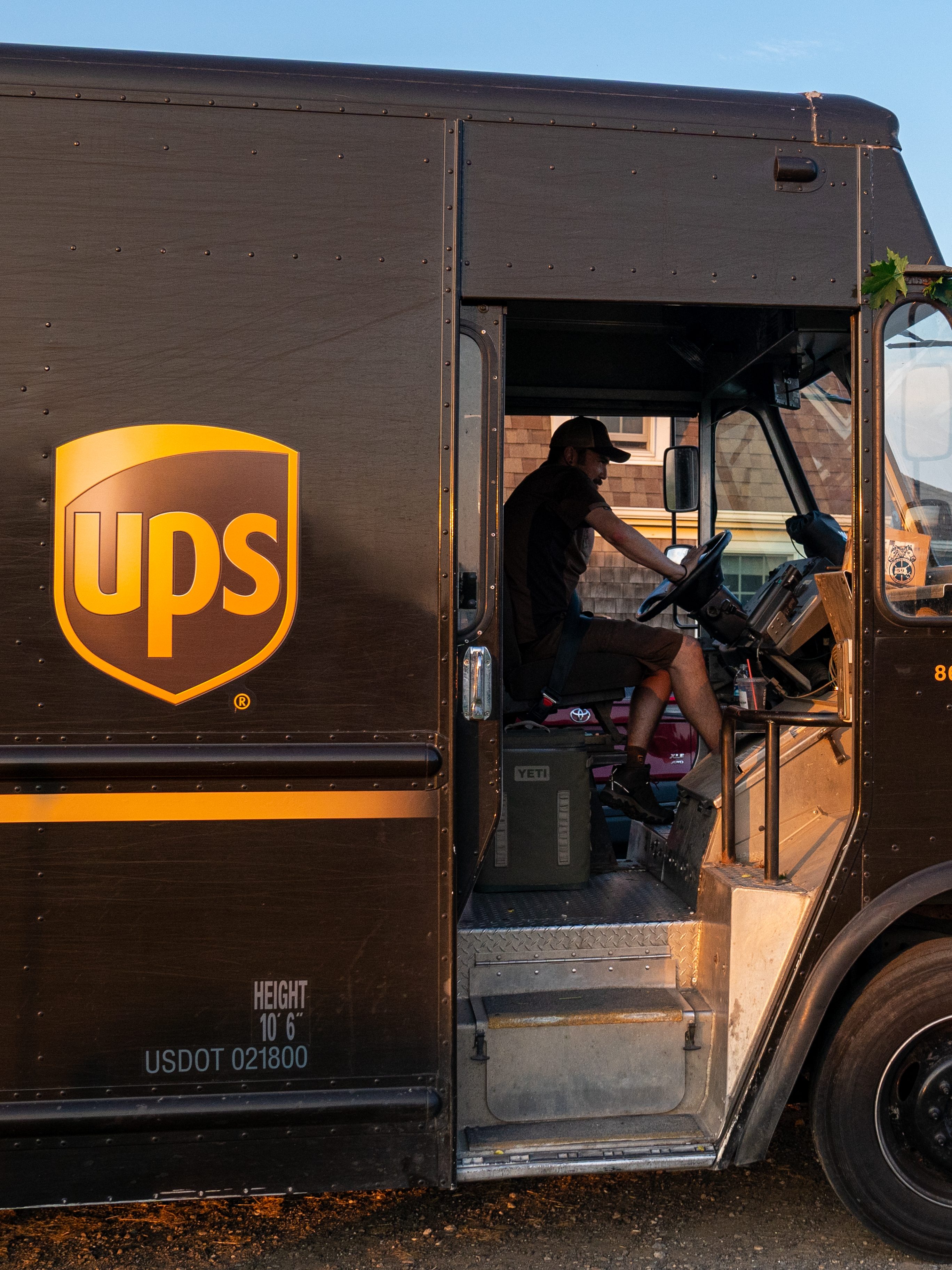 ORLEANS, MA - JULY 24: A United Parcel Service truck searches for a house driving along the coast of Cape Cod on July 24, 2023 in Orleans, Massachusetts. UPS employees threatened to go on strike if contract talks between UPS and the Teamsters Union, which represents more than half of the 340,000 employees, do not reach an agreement. (Photo by Robert Nickelsberg/Getty Images)