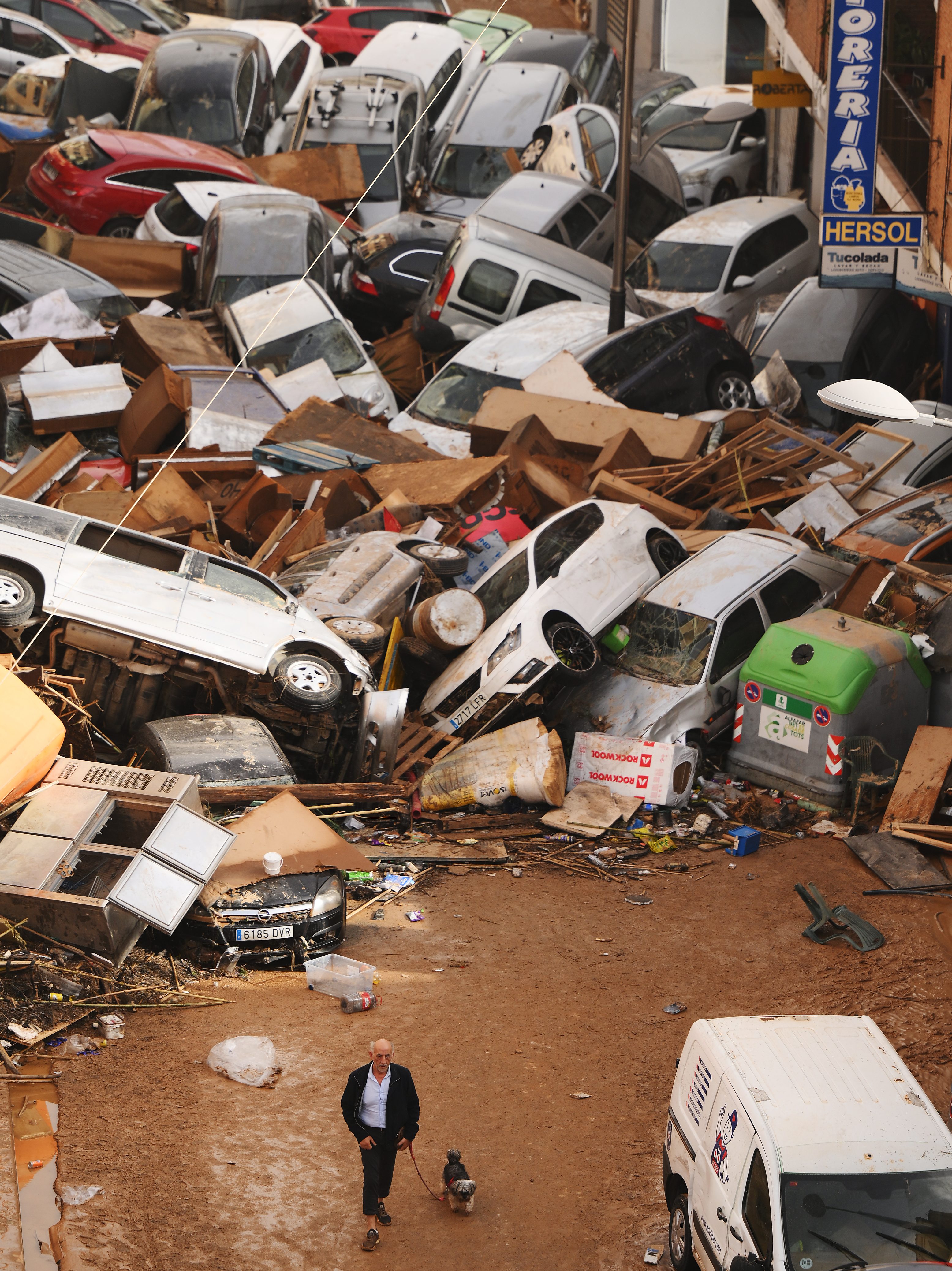 VALENCIA, SPAIN - OCTOBER 30: Cars are piled in the street with other debris after flash floods hit the region on October 30, 2024 in the Sedaví area of Valencia, Spain. Spanish authorities said on Wednesday that at least 62 people had died in the Valencia region overnight after flash-flooding followed heavy rain. Spain's meteorological agency had issued its highest alert for the region due to extreme rainfall. (Photo by David Ramos/Getty Images)